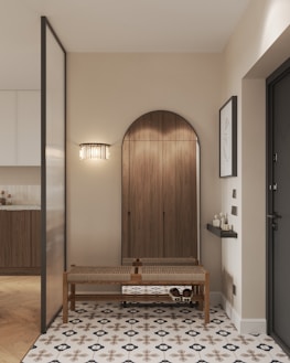 A room with a table and a bench in it
