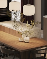 A kitchen with a table, chairs and a stove