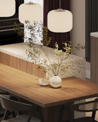 A kitchen with a table, chairs and a stove