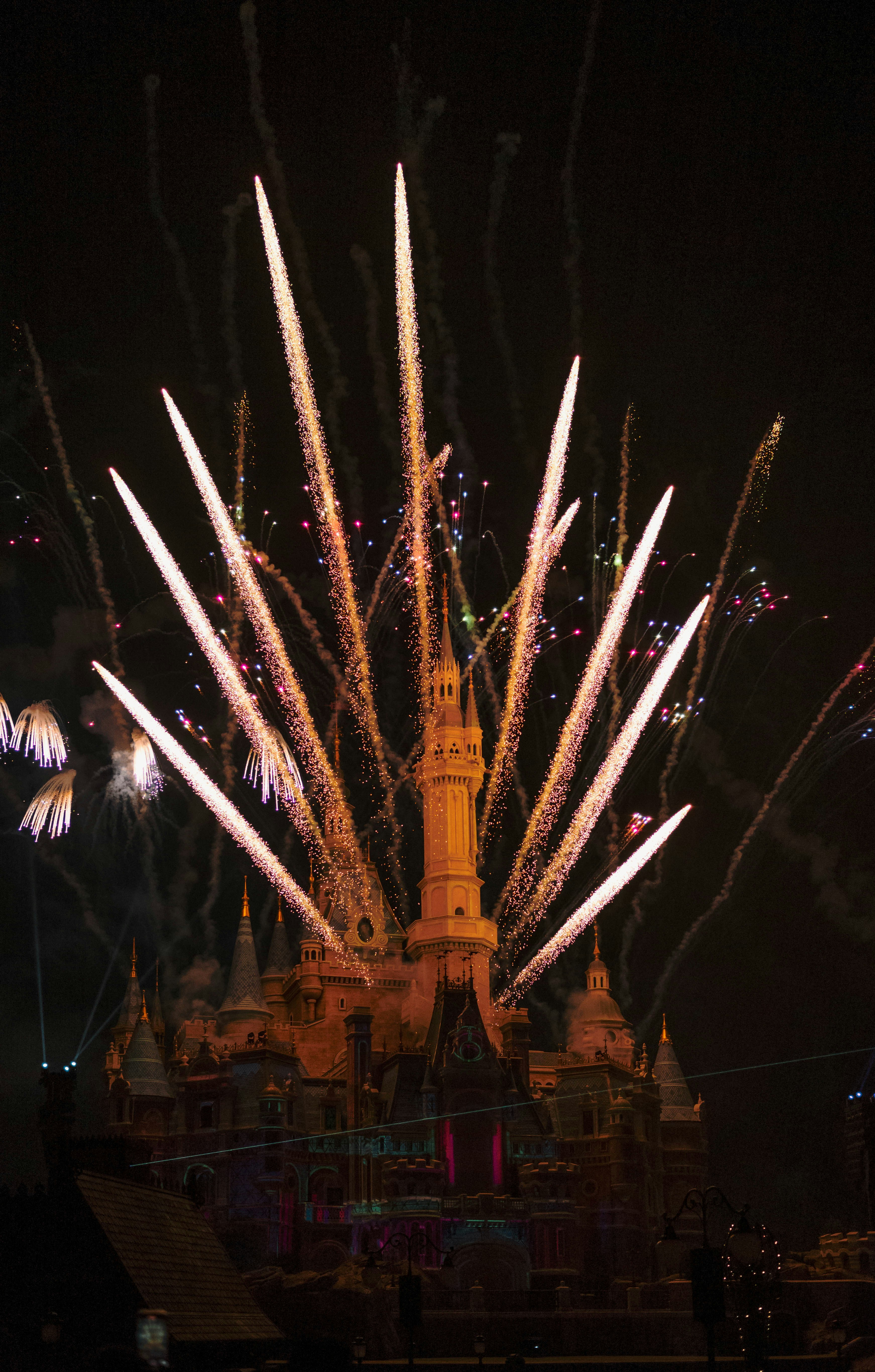 A fireworks display in front of a castle at night photo – Free ...