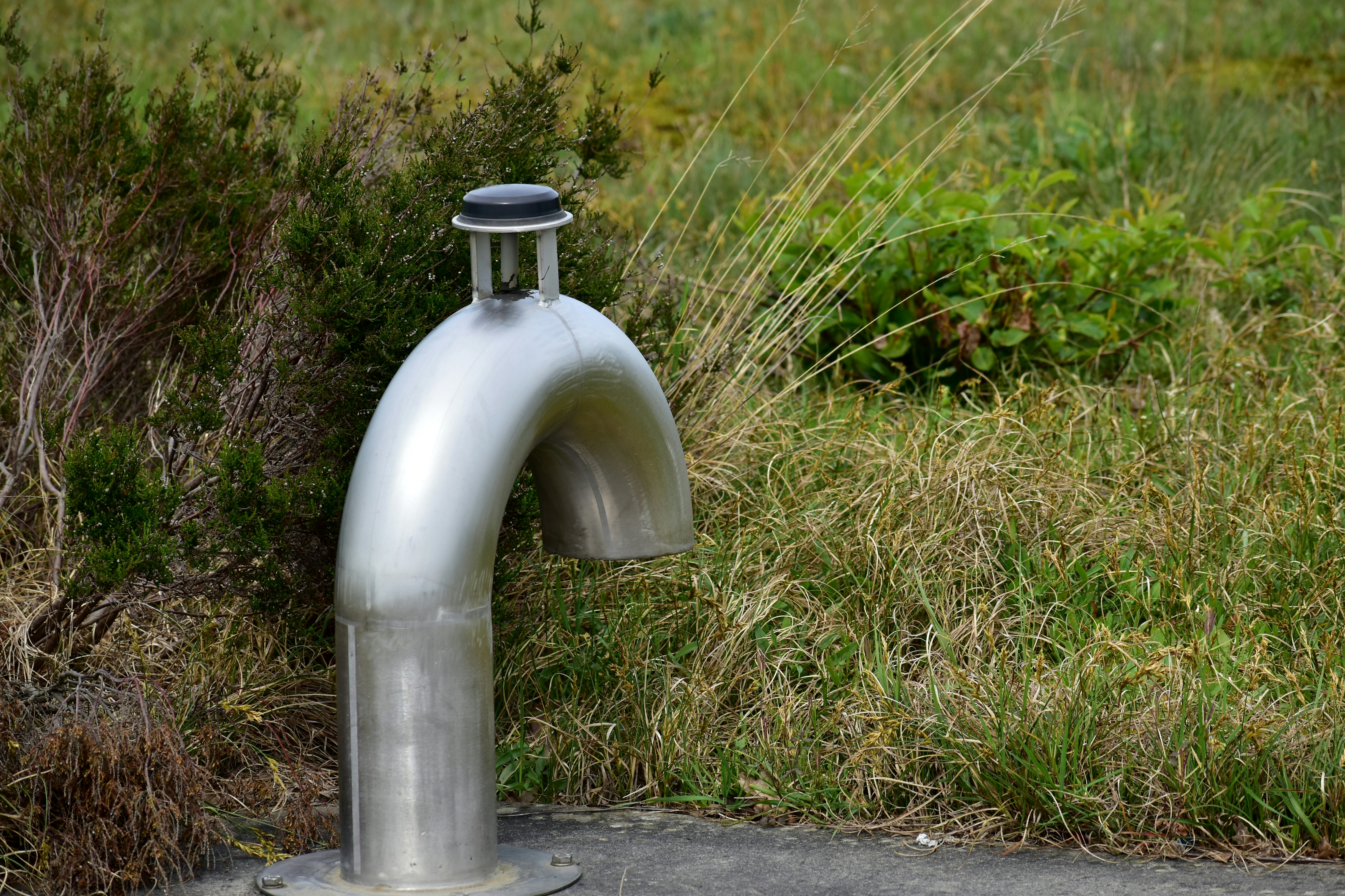 A fire hydrant sitting on the side of a road