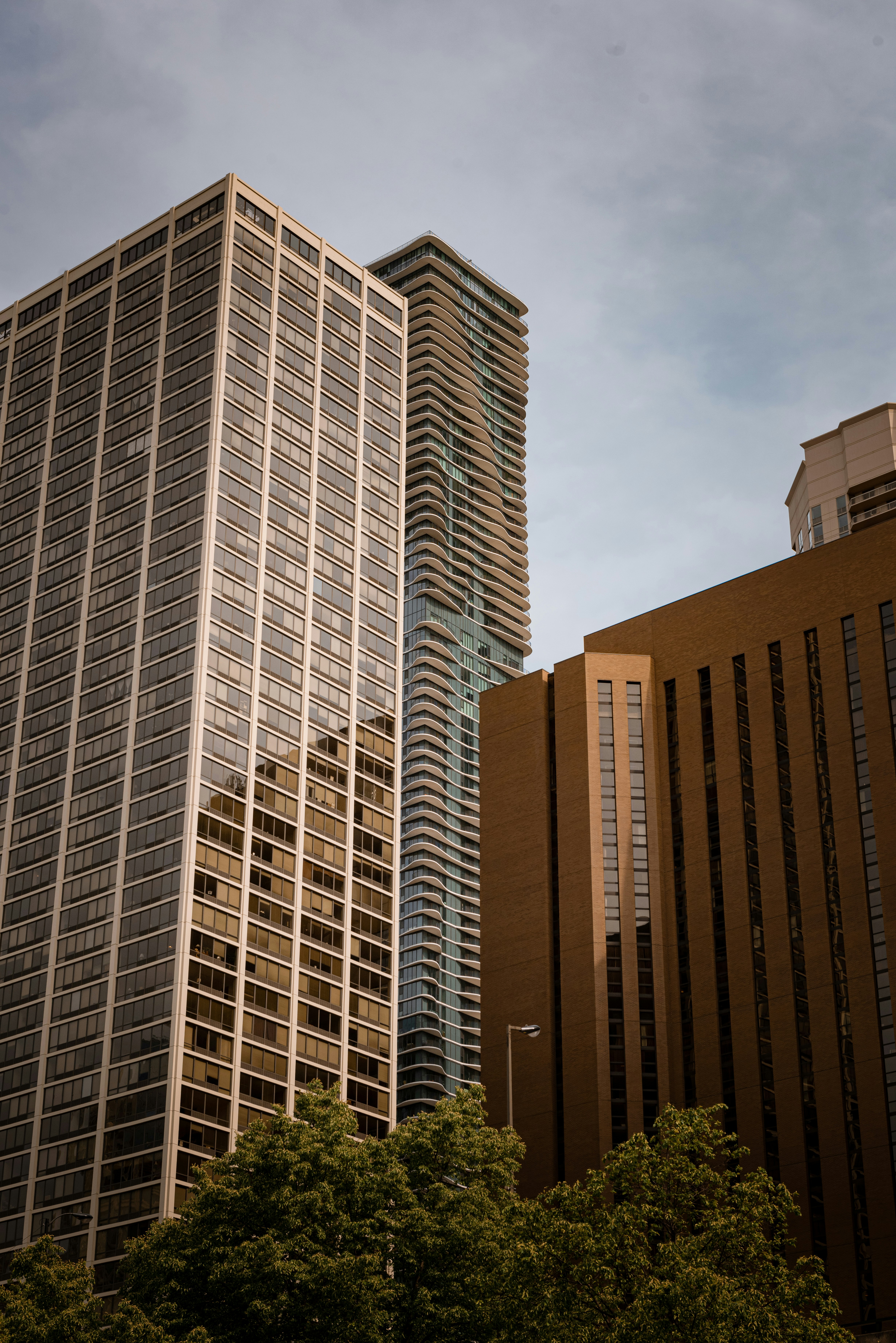 A couple of tall buildings sitting next to each other