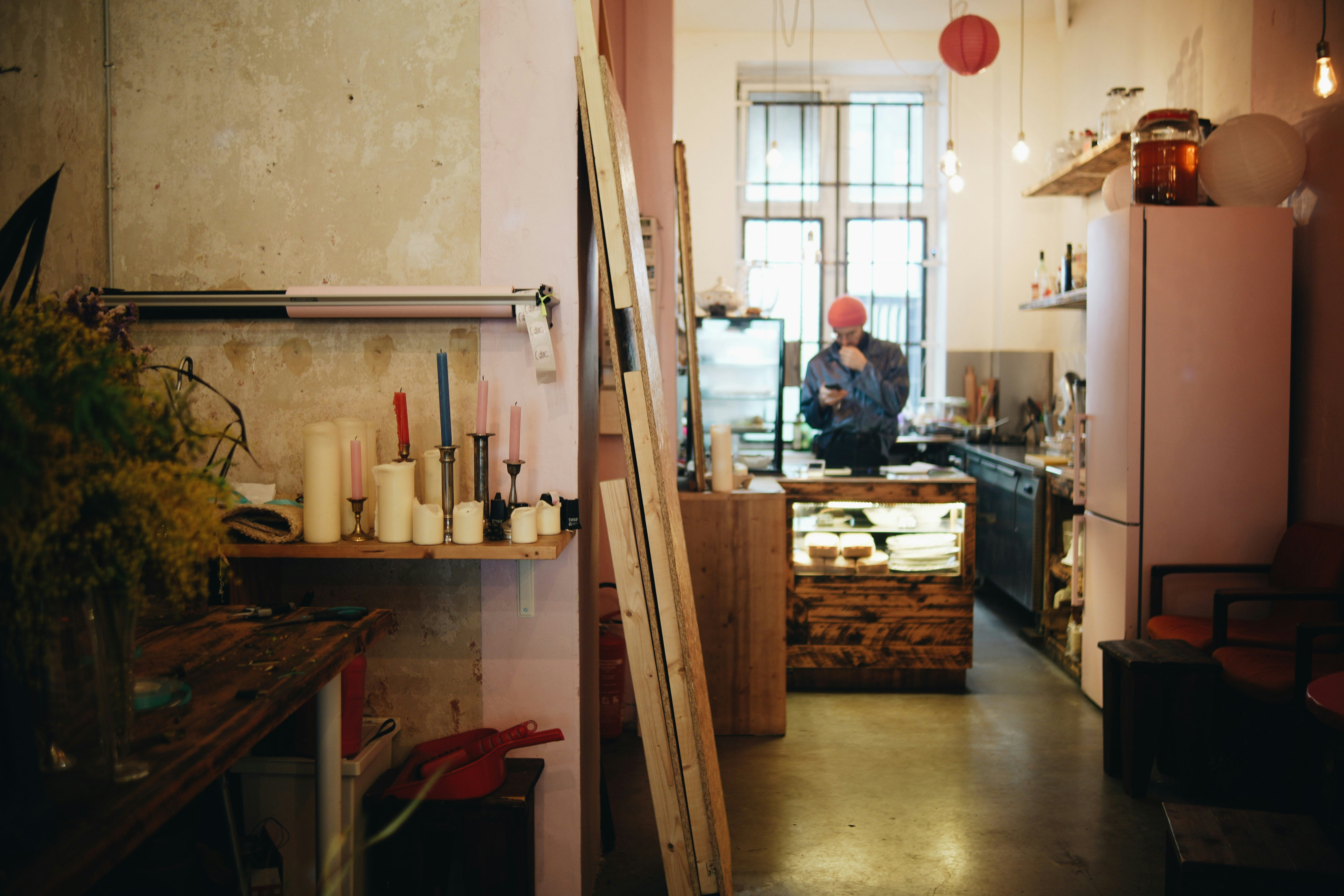A man in a kitchen with a ladder in front of him