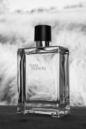 A bottle of perfume sitting on top of a table