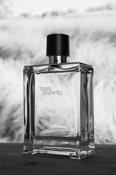 A bottle of perfume sitting on top of a table
