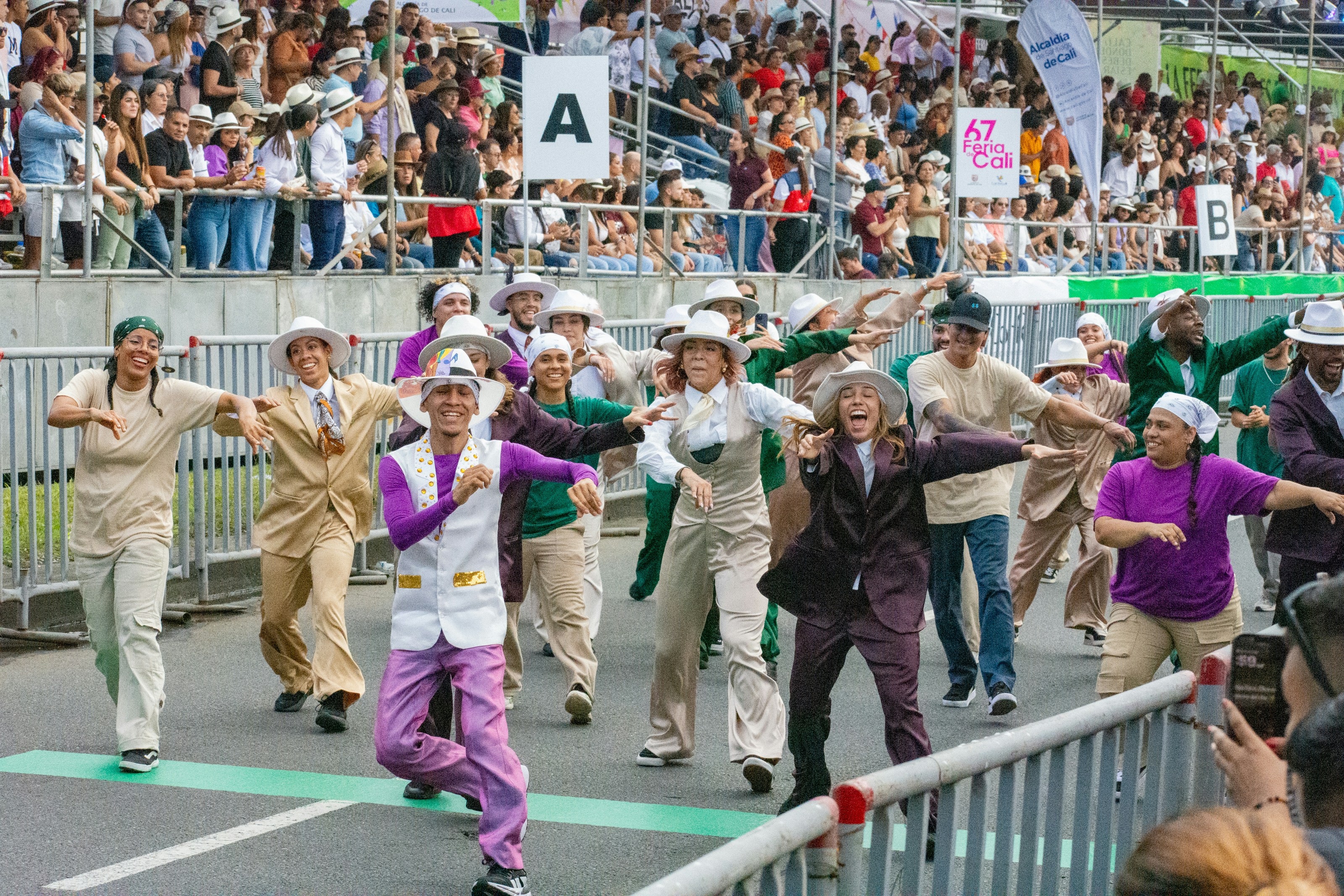 A group of people dancing in front of a crowd