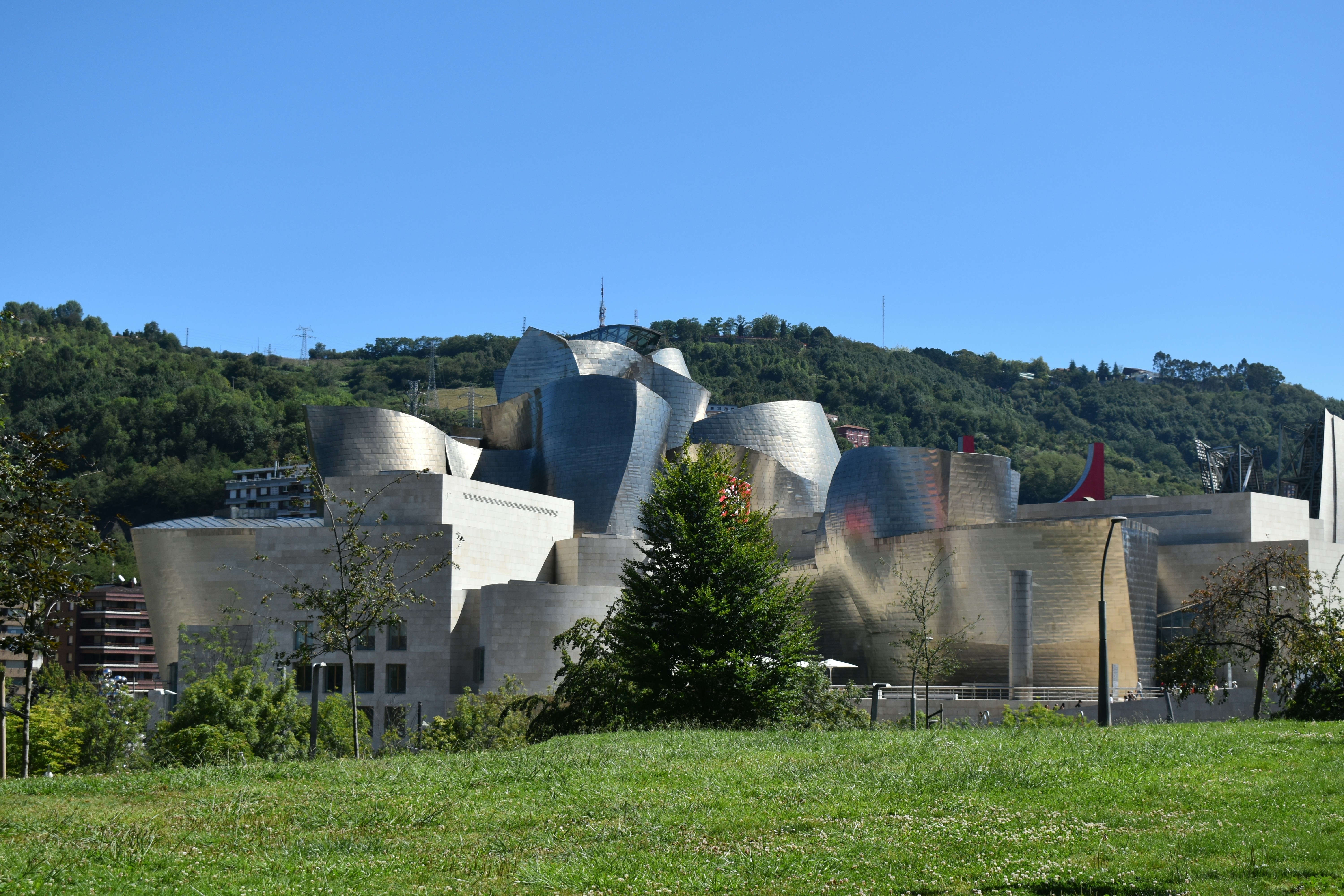 A view of a building in the middle of a field