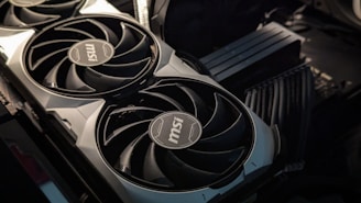 A close up of a computer motherboard with two fans