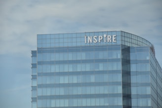 A very tall building with a sign on top of it