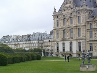 A large building with a statue in front of it