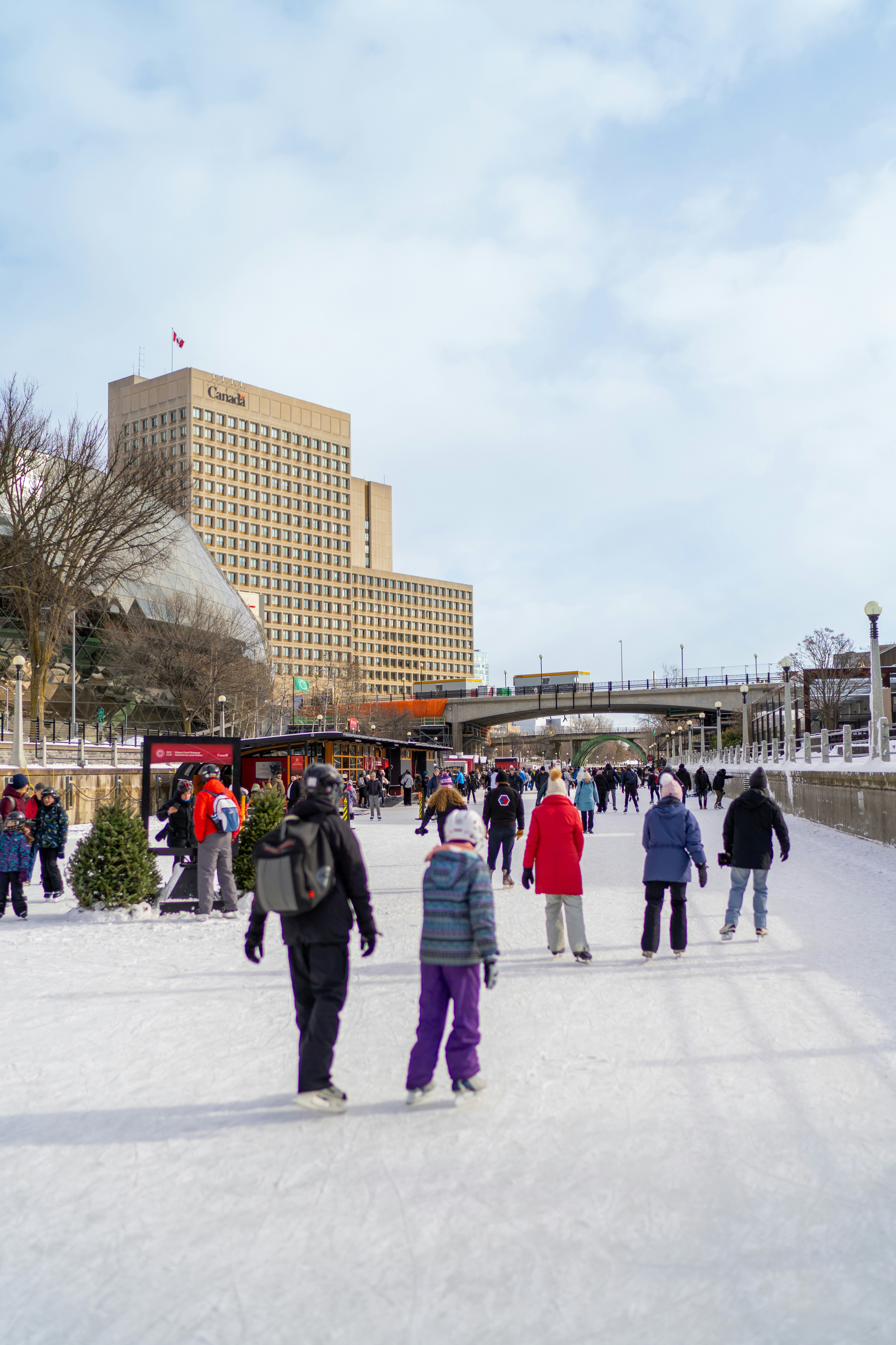 A group of people standing on top of snow covered ground