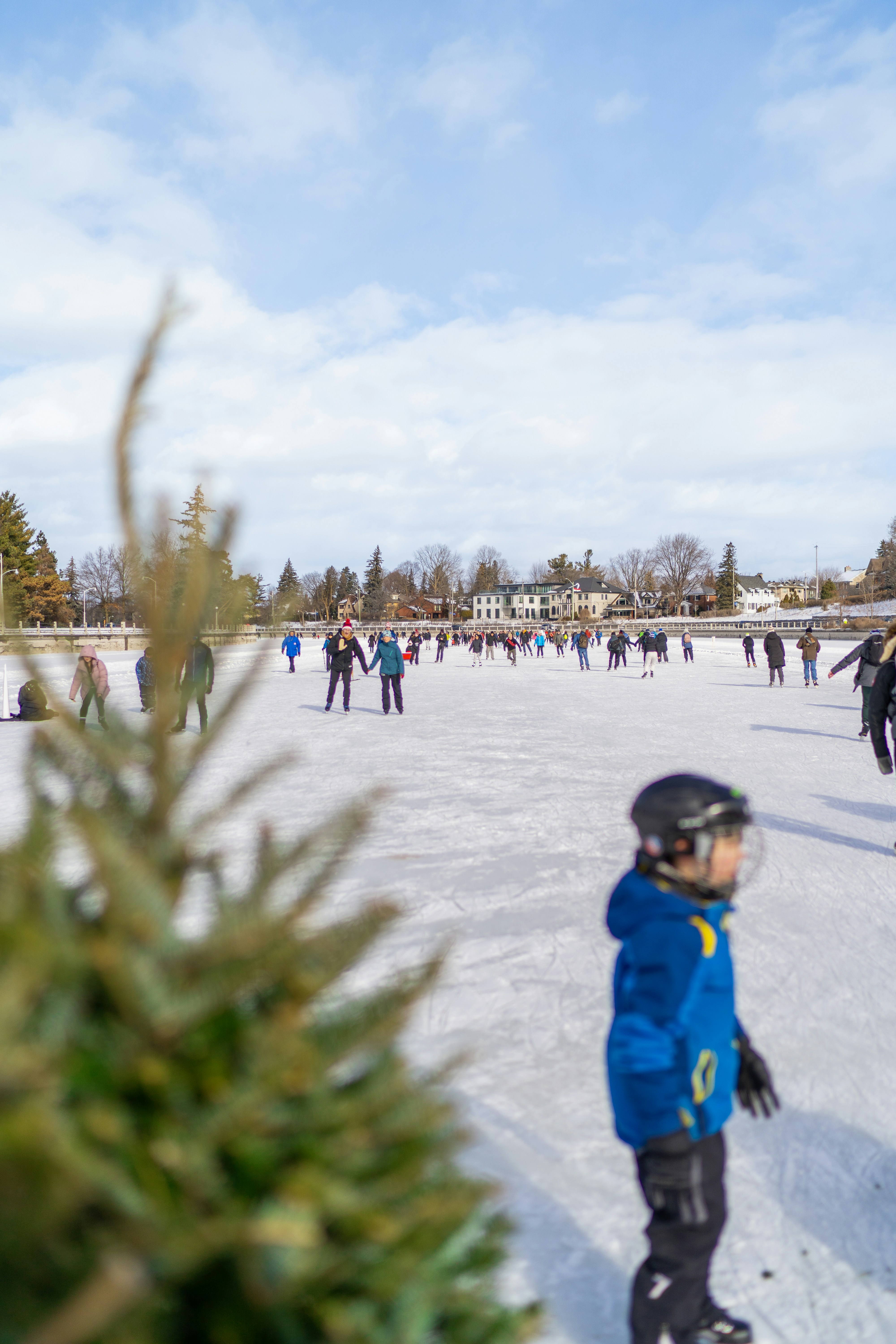 A group of people riding skis on top of a snow covered slope