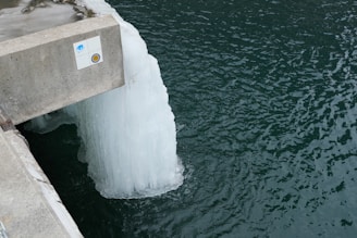 An iceberg floating in a body of water