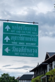 A street sign hanging from the side of a metal pole