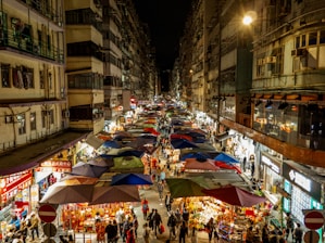 A crowded city street filled with lots of people