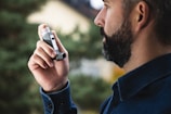 A man holding a cell phone up to his ear
