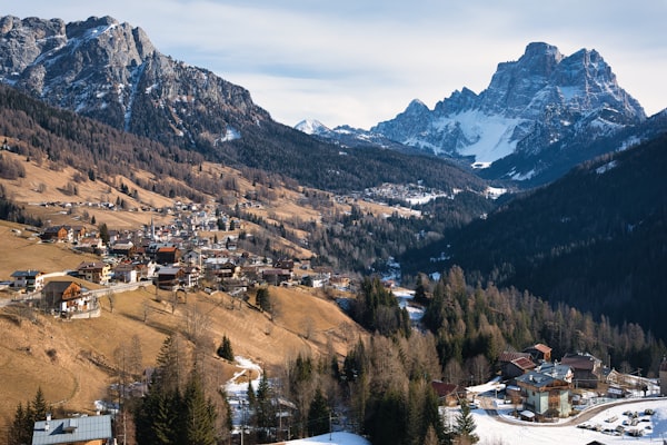 Snowy mountain town with snow-covered rooftops and peaks