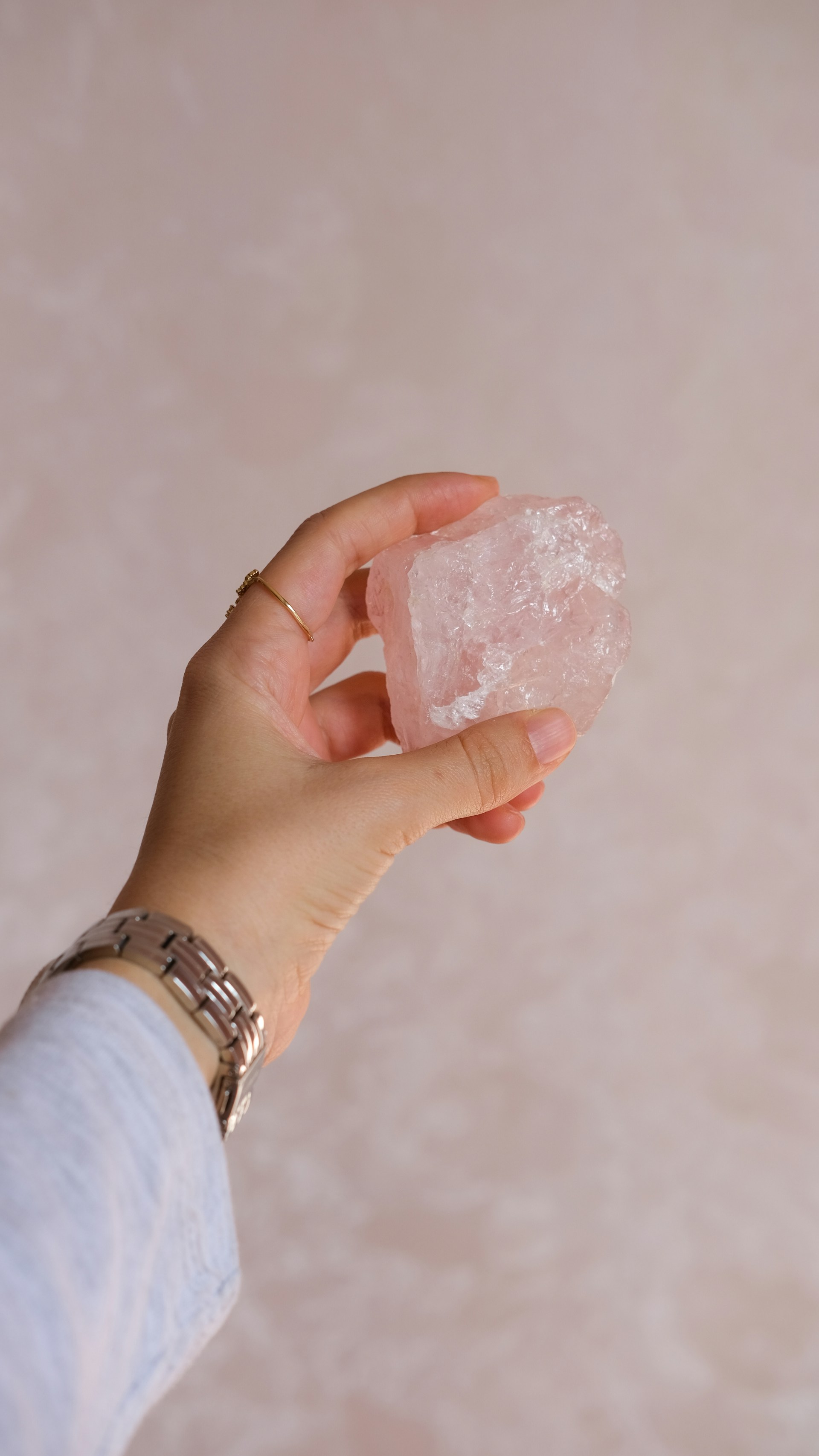A person holding a piece of ice in their hand