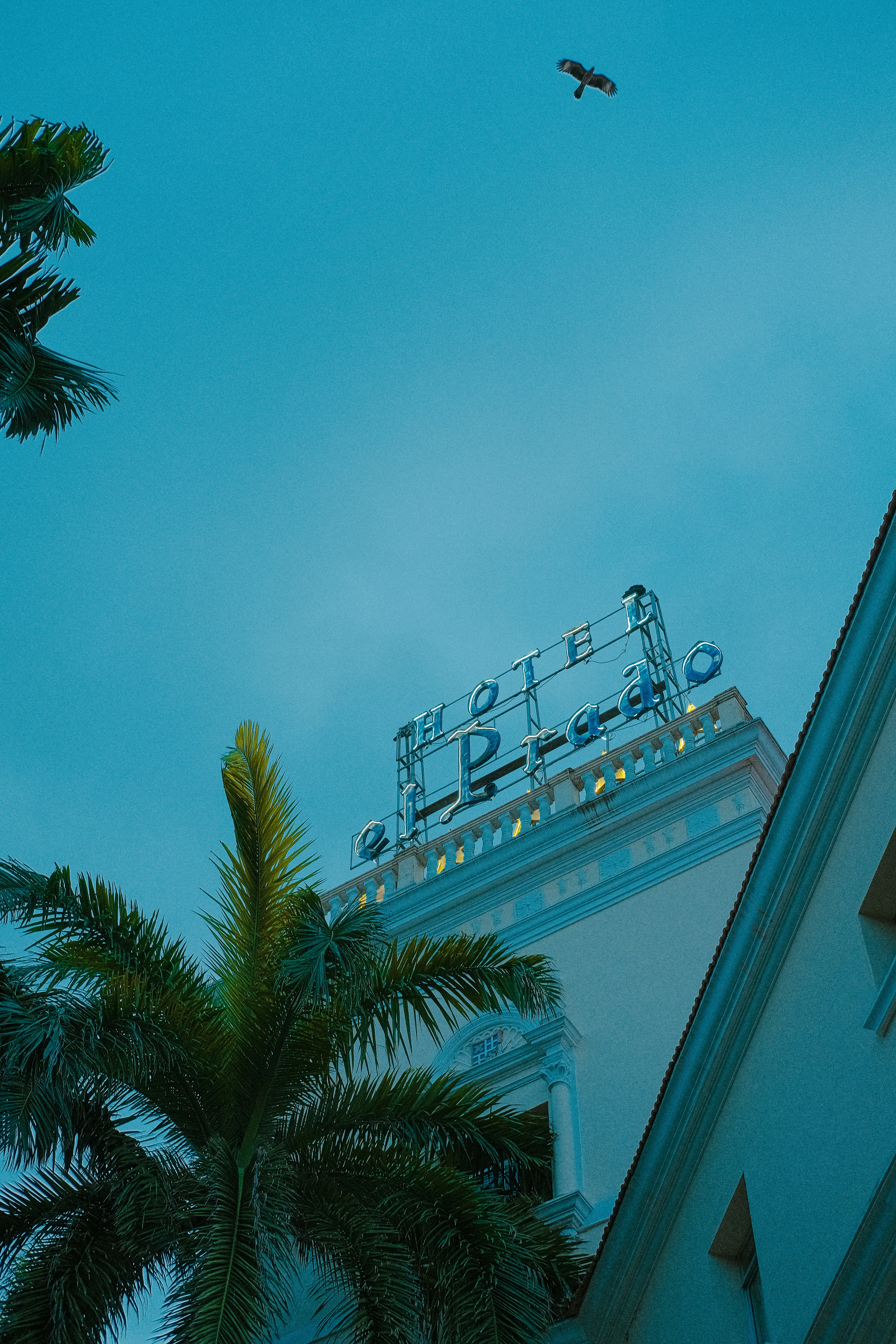 A tall building with a sign on top of it