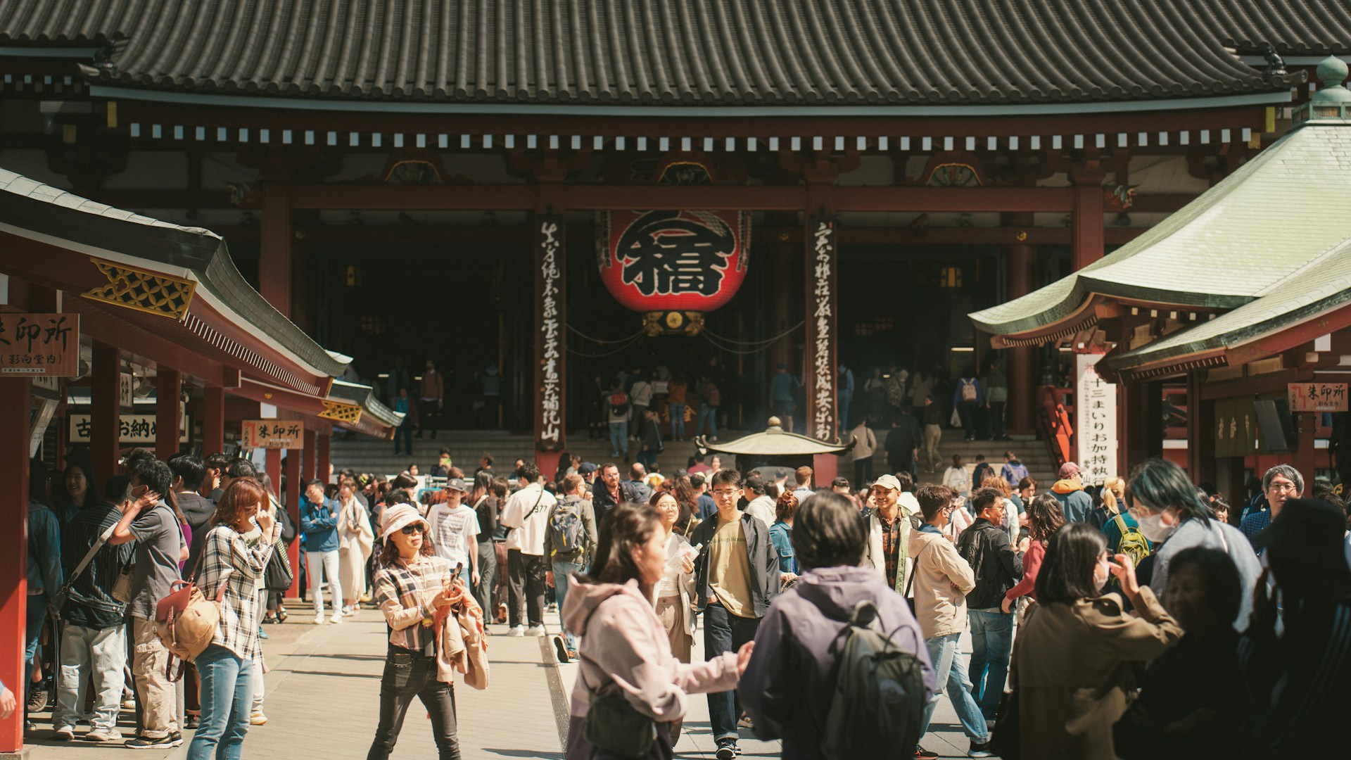 A group of people standing in front of a building