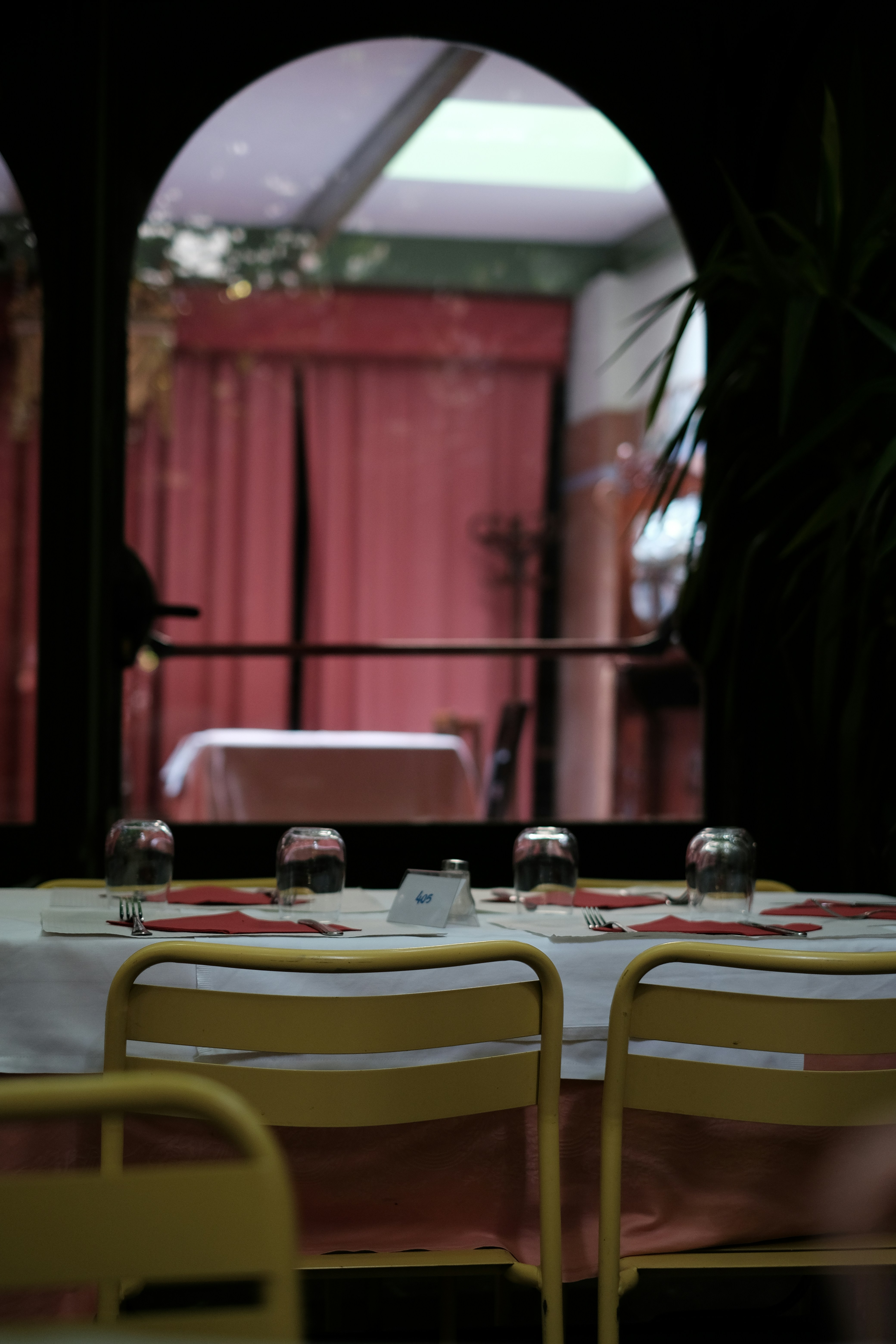 A dining room with a table and chairs
