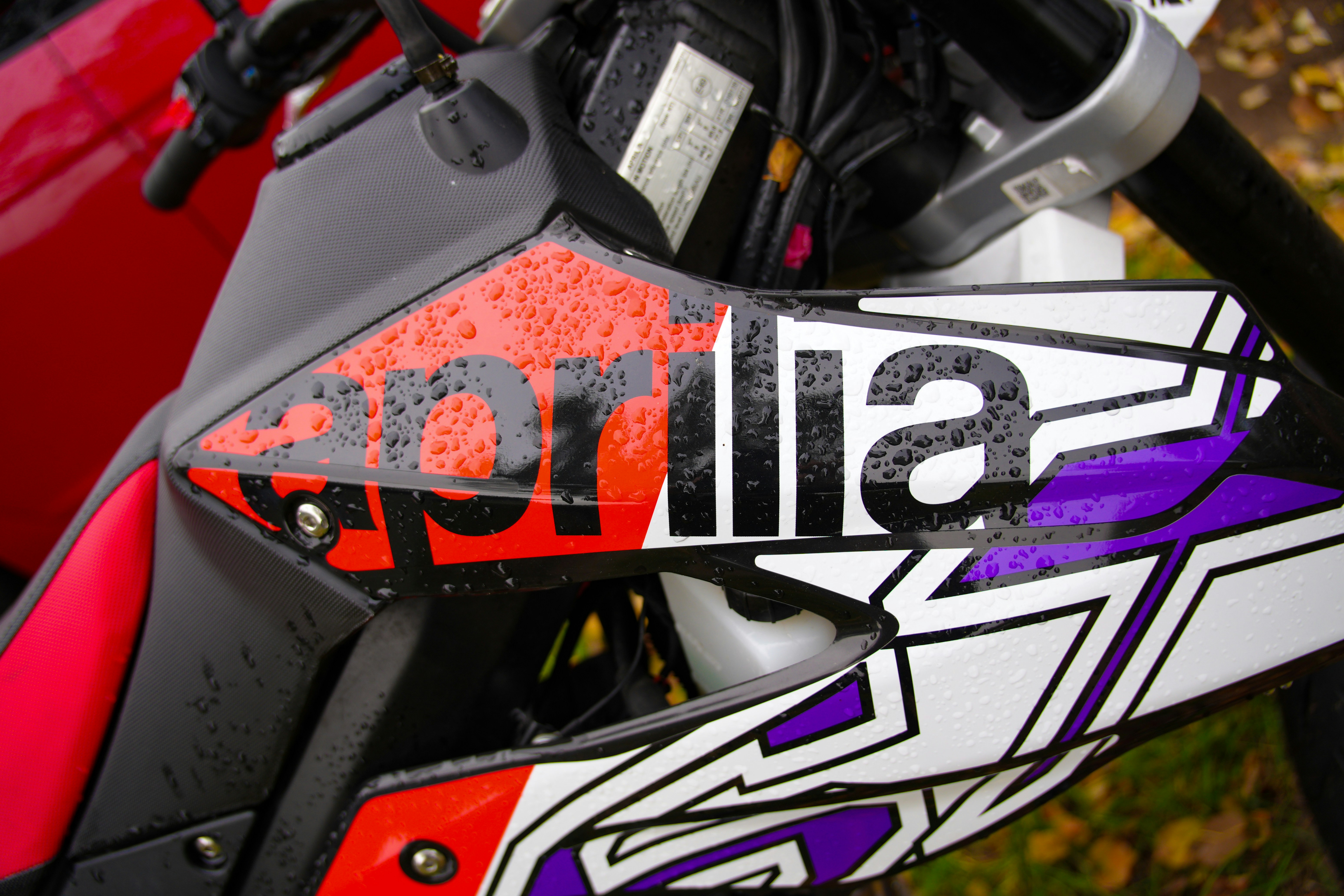 A close up of a motorcycle parked in a field