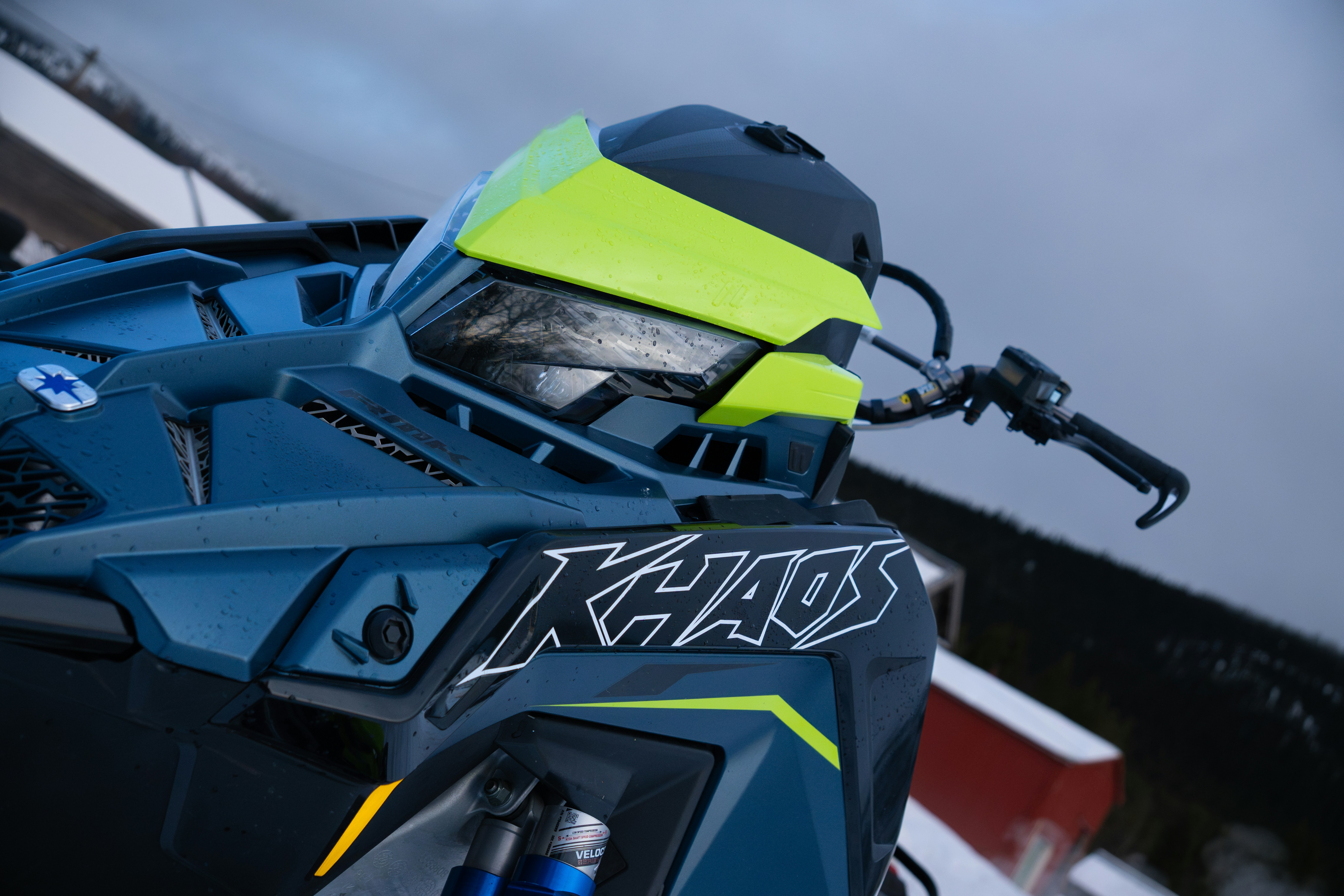 A close up of a blue and yellow motorcycle