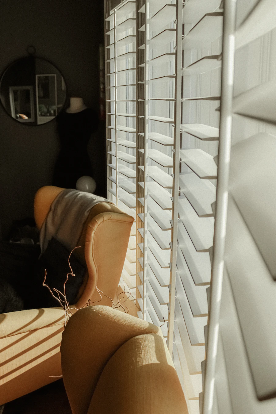 White window blinds installed inside a living room