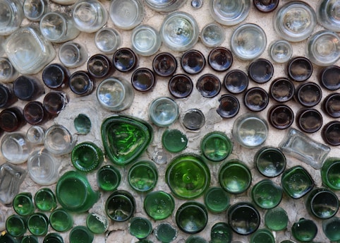 A group of glass bottles sitting on top of a table