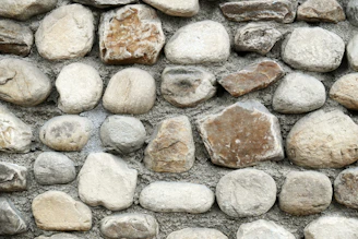 A close up of a stone wall made of rocks