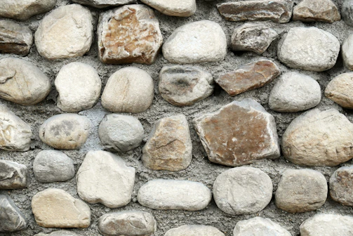 A close up of a stone wall made of rocks