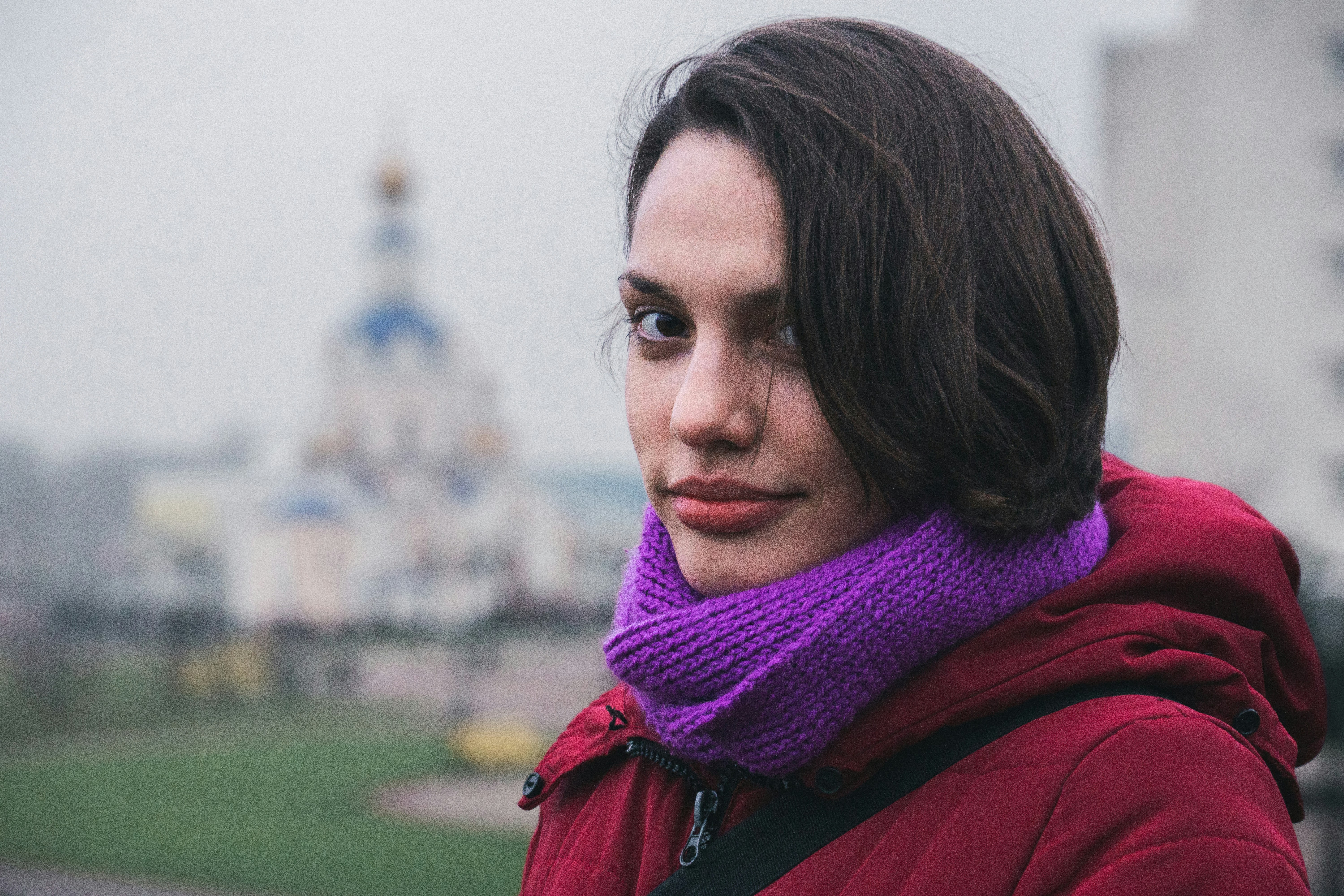A woman with a purple scarf around her neck