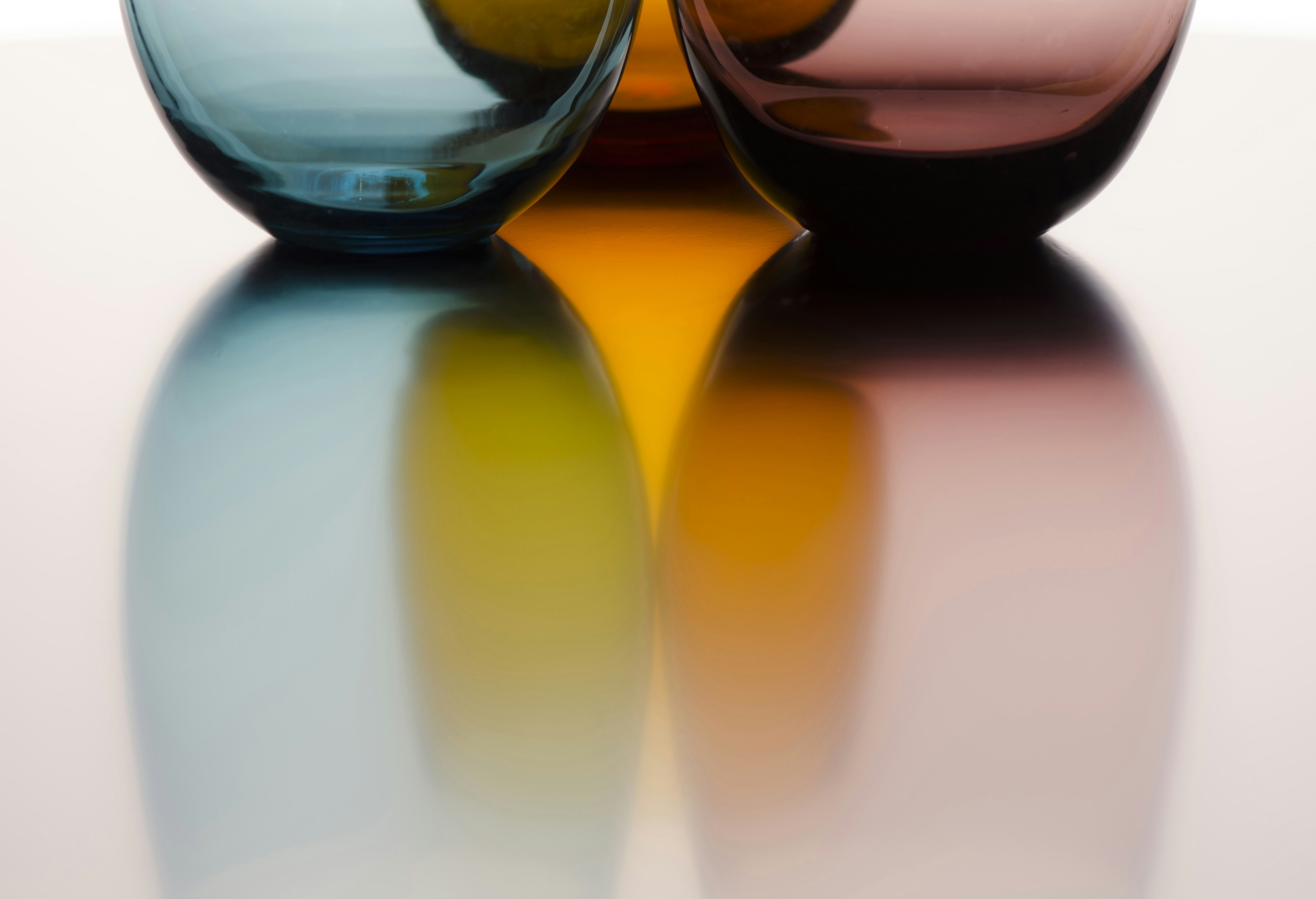 A couple of vases sitting on top of a table