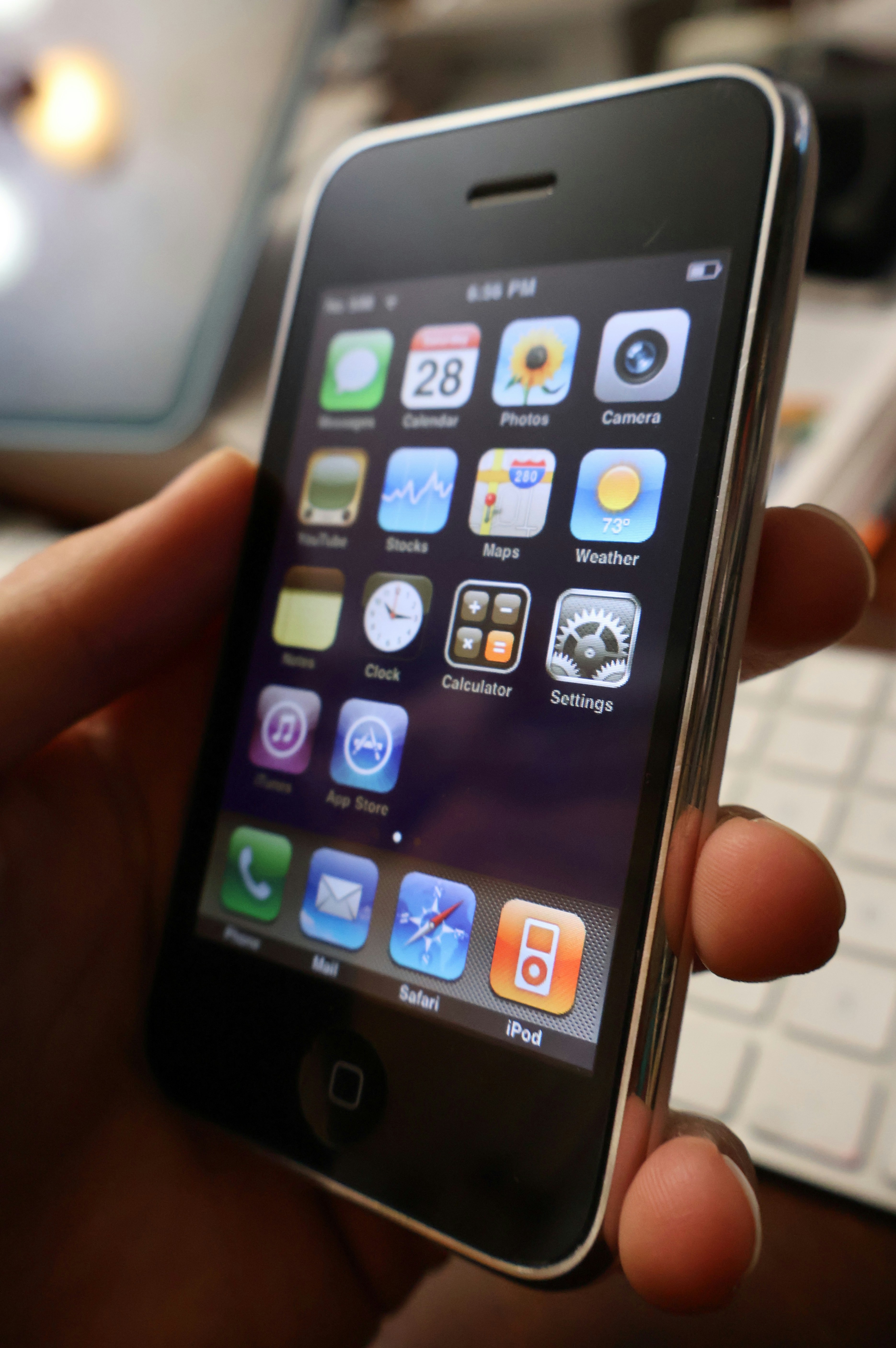 A person holding a smart phone in their hand