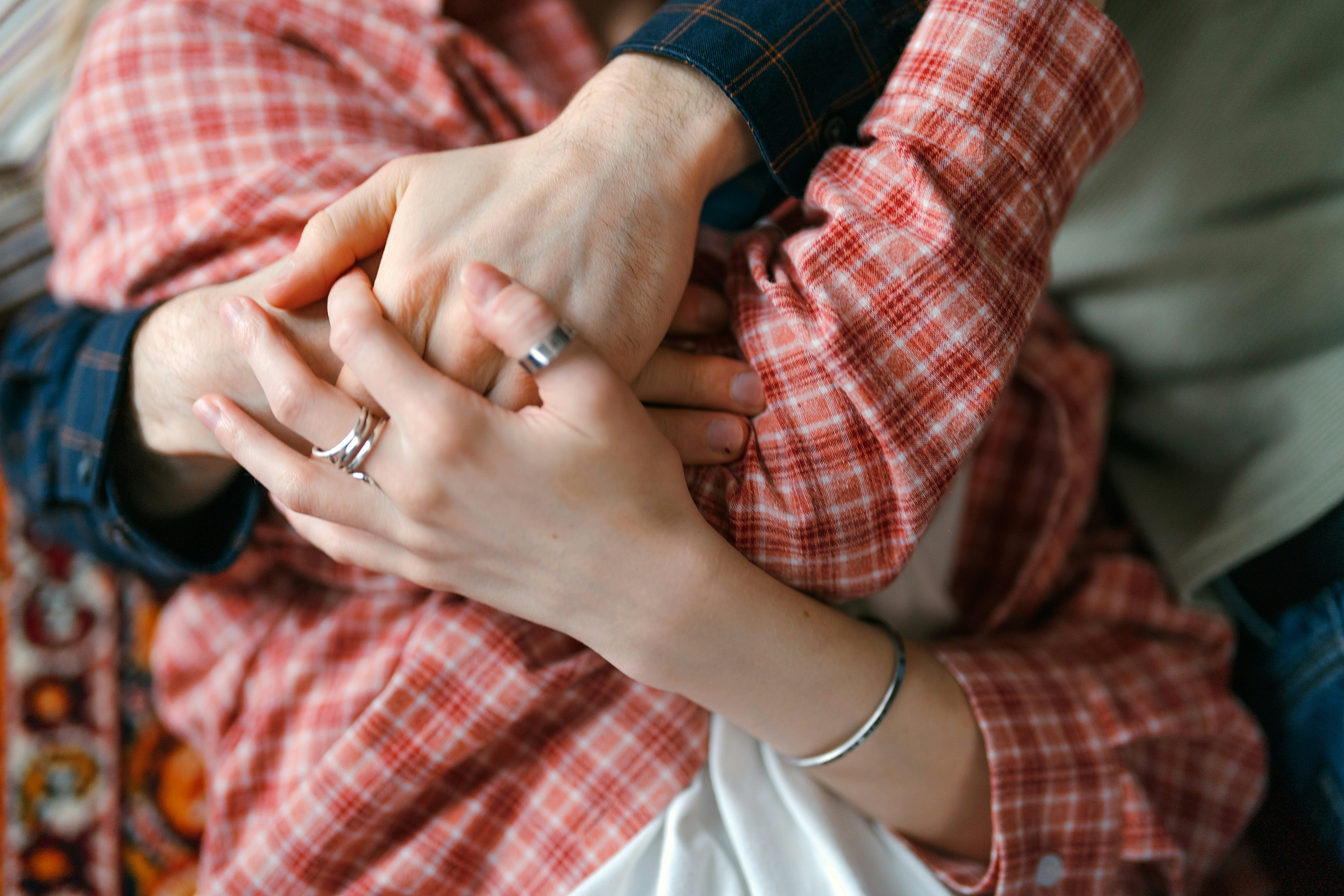 Loving embrace that radiates safety and natural happiness between two committed partners.