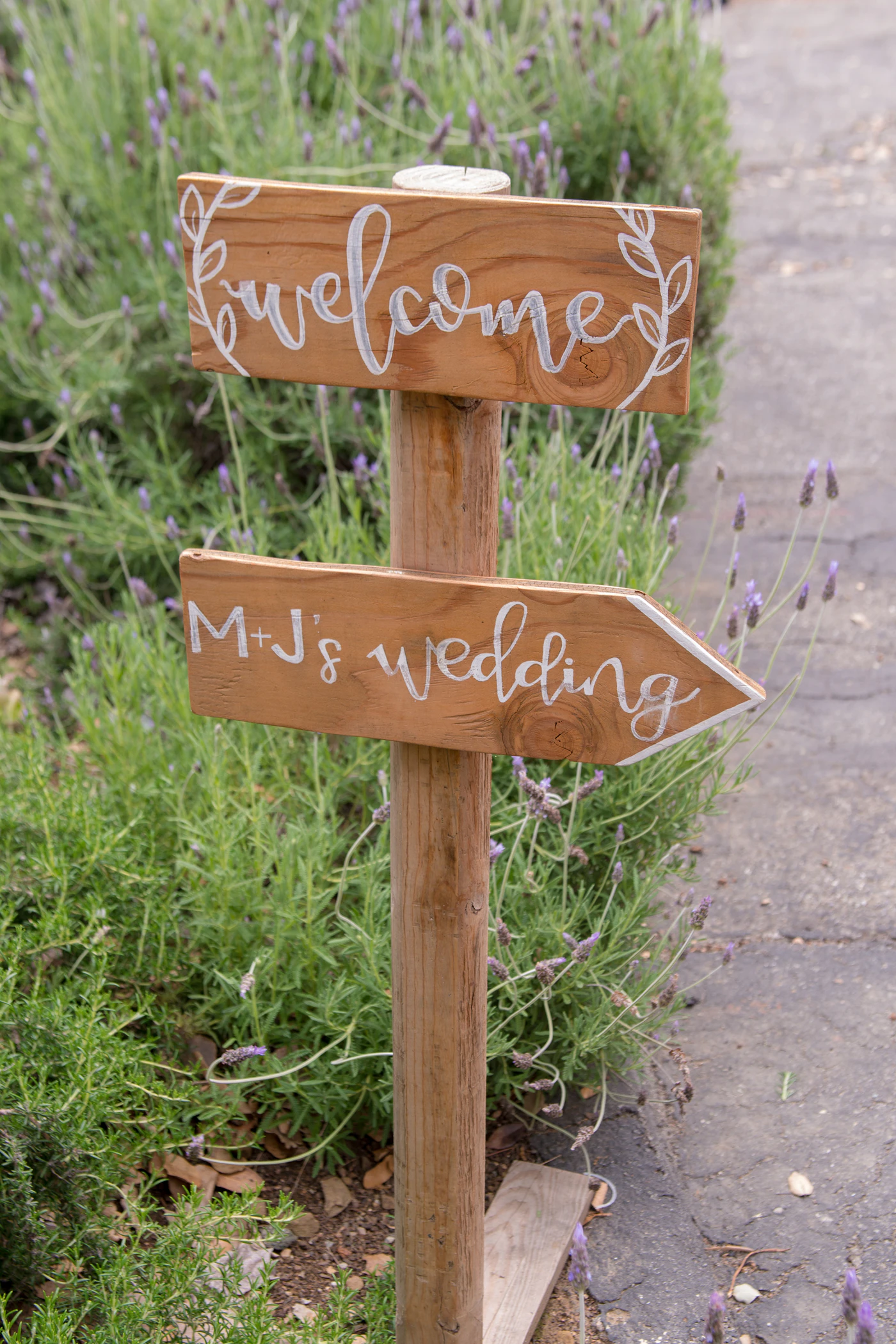 Ceremony programs with QR codes for digital interaction — A QR code welcome sign displayed at a wedding ceremony entrance.