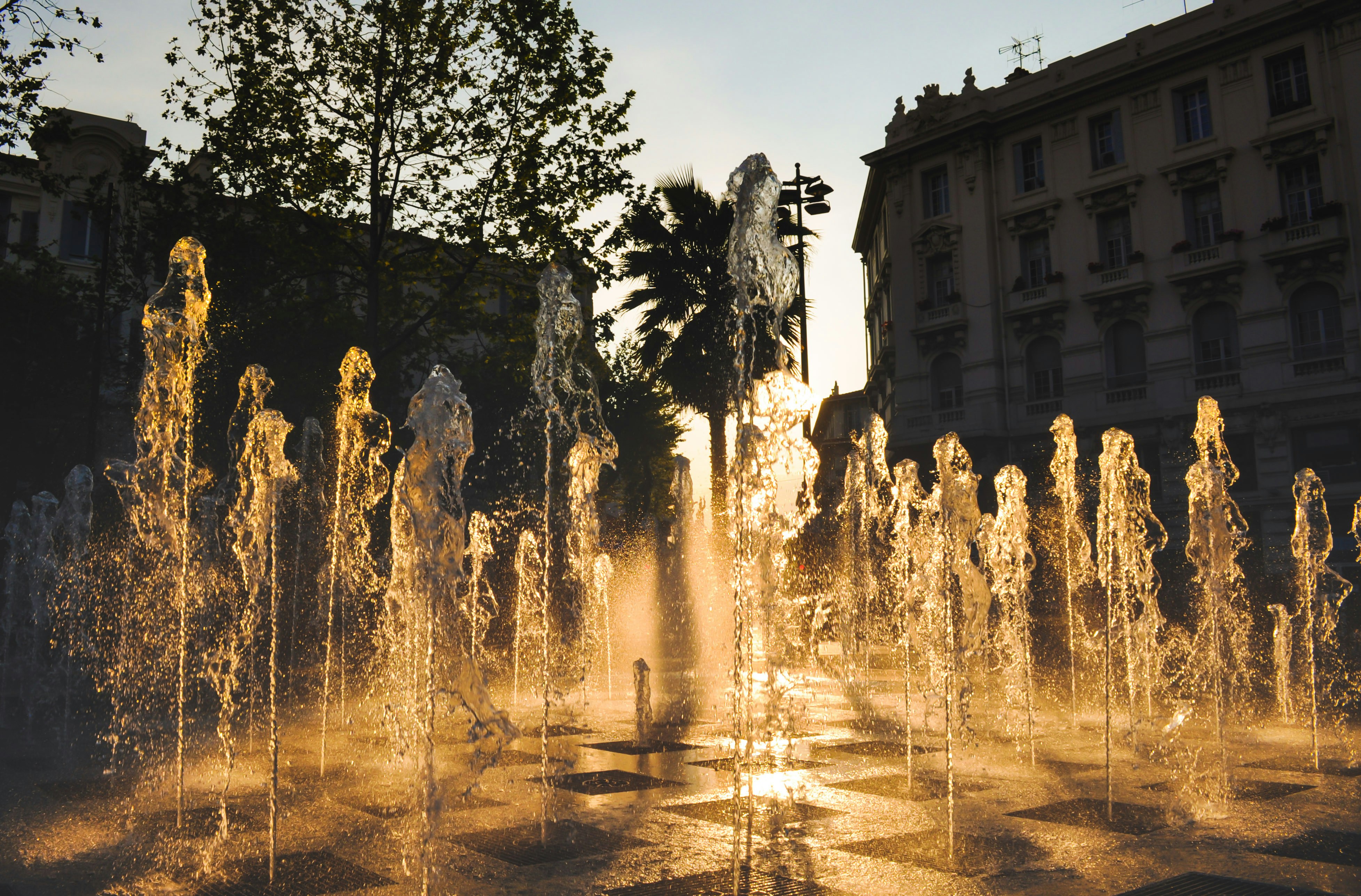 A large fountain with water spewing out of it's sides