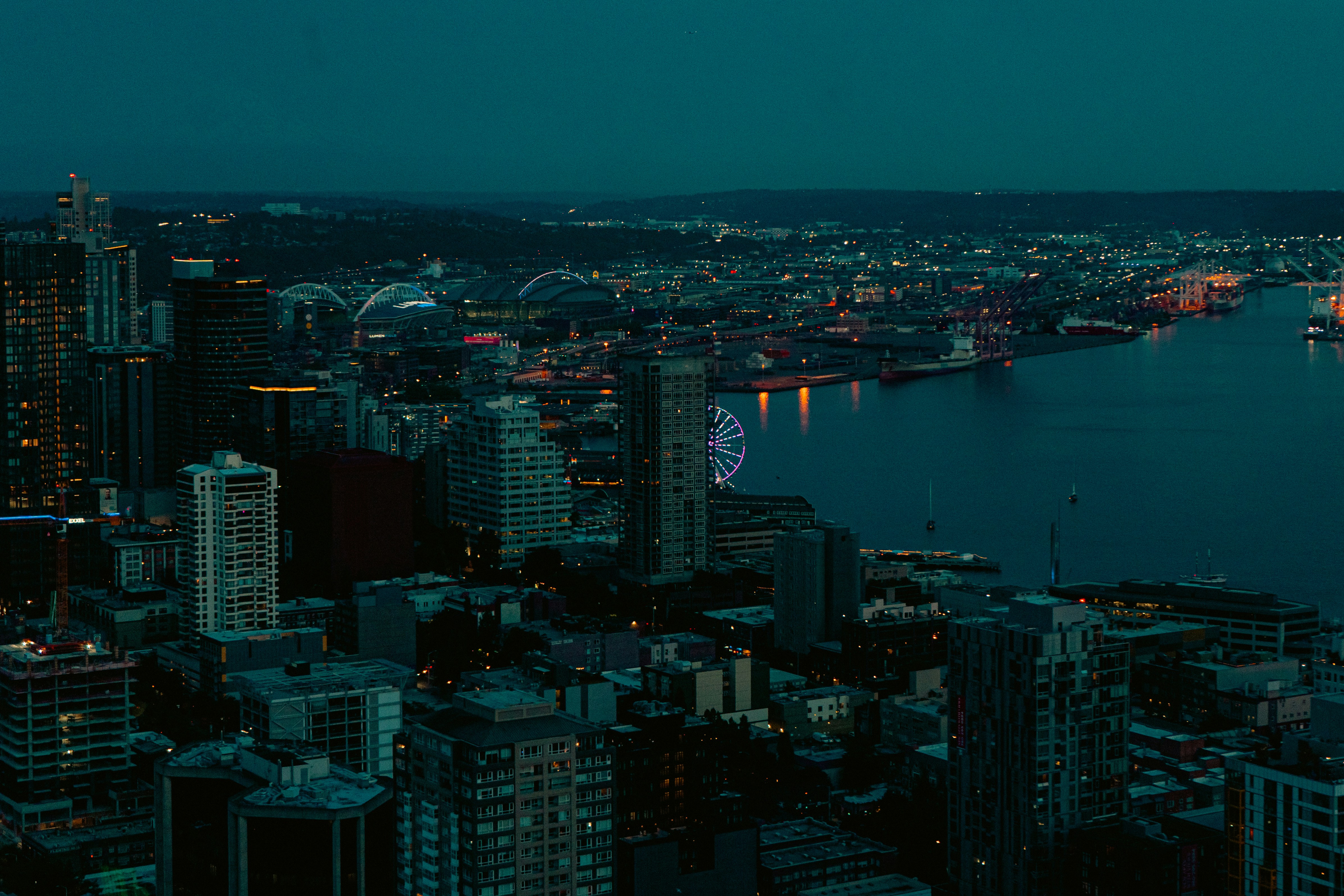 A view of a city at night from the top of a building