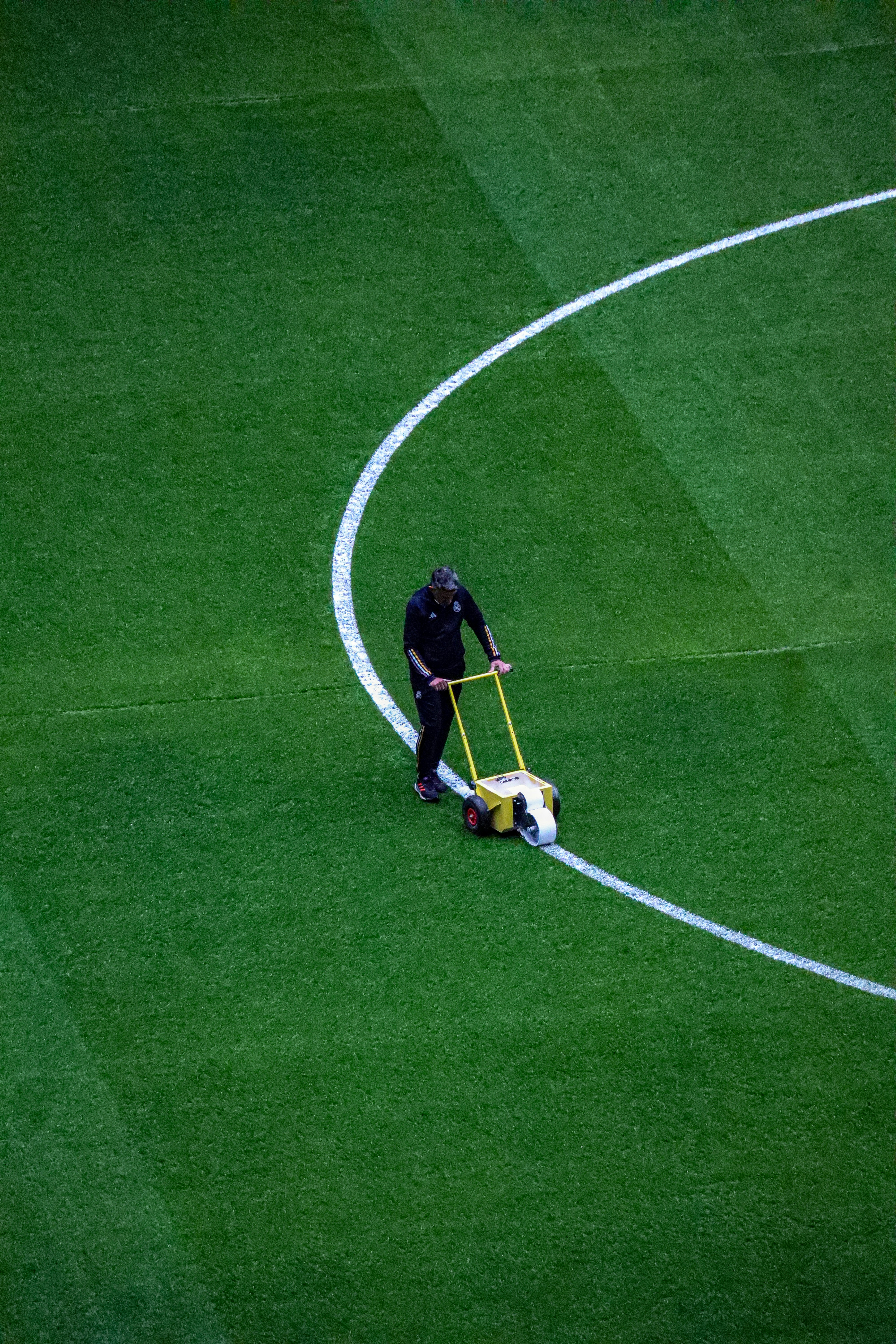 A man with a soccer ball on a soccer field