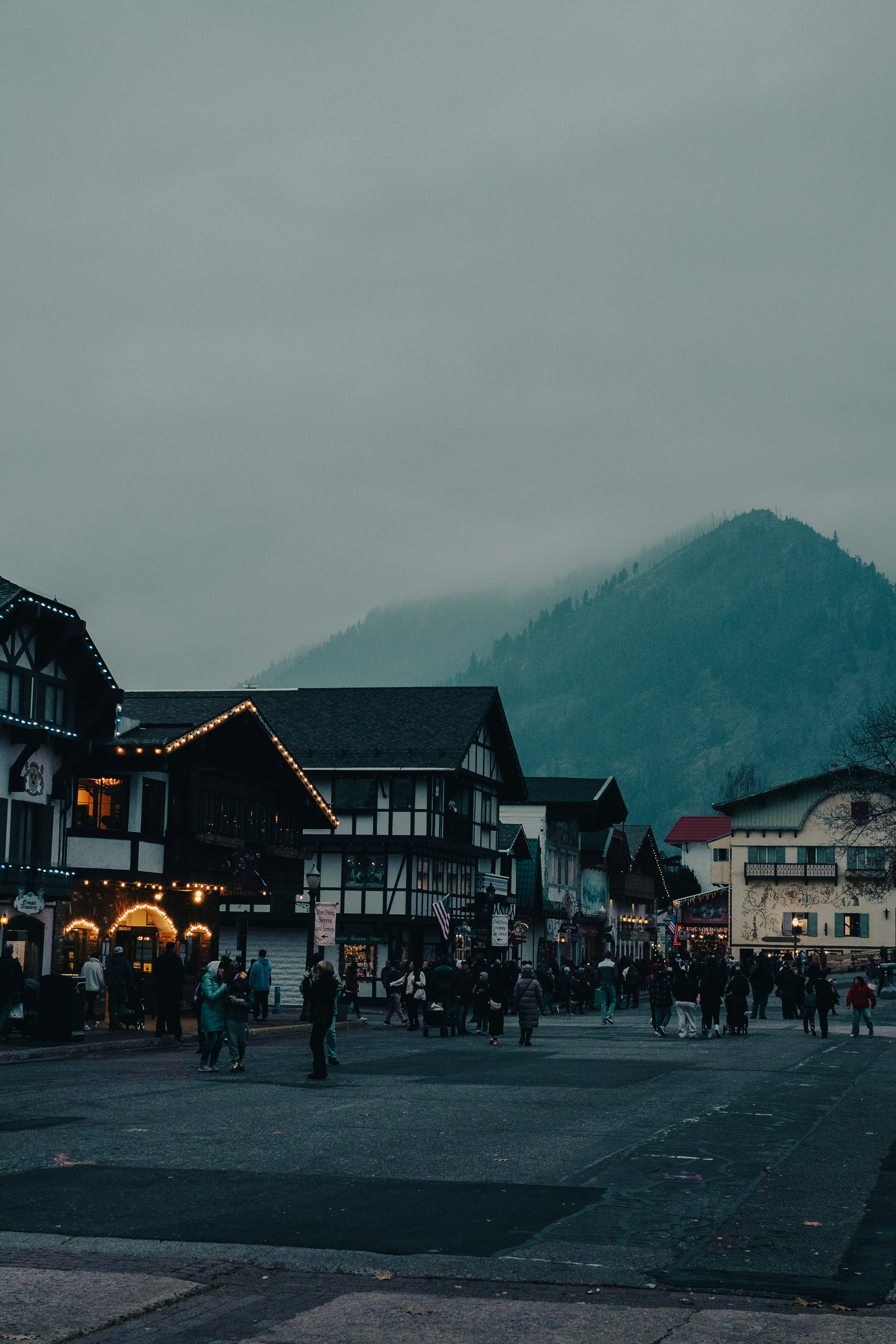A group of people walking around a town square