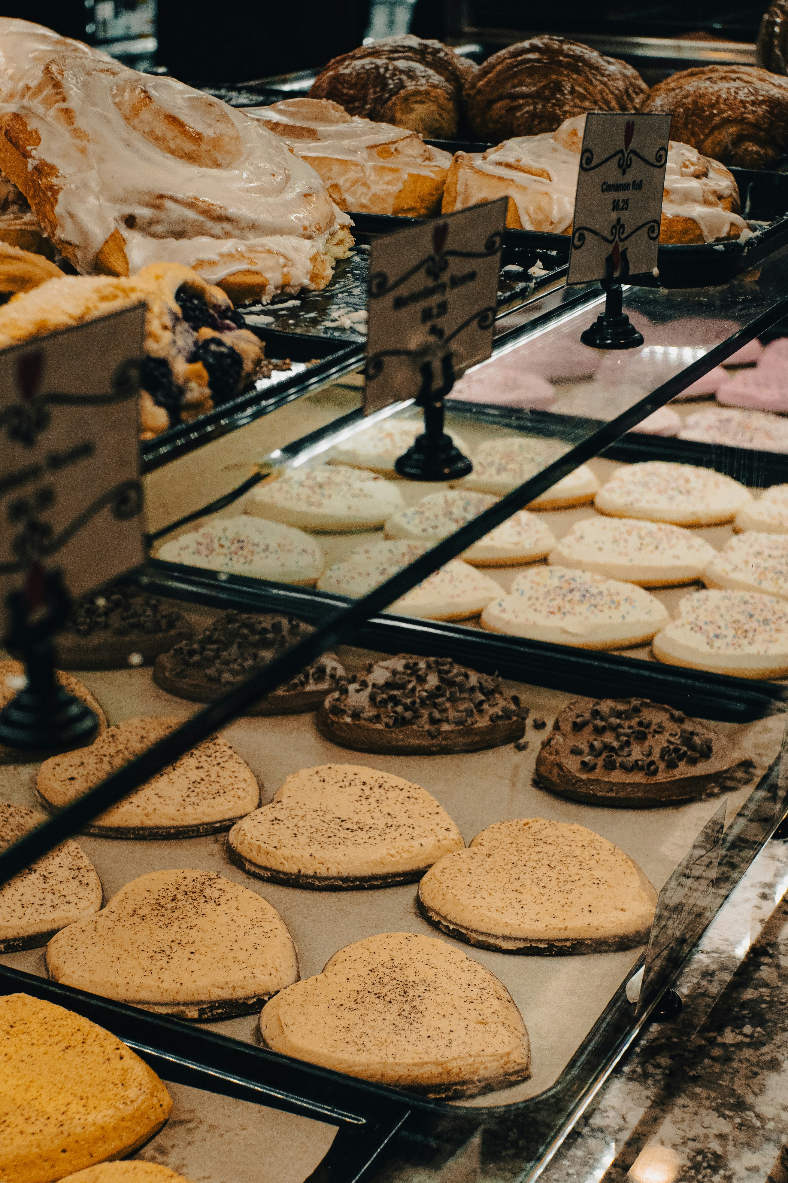 A display case filled with lots of different types of pastries