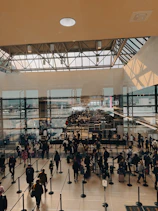 A large group of people walking around a building