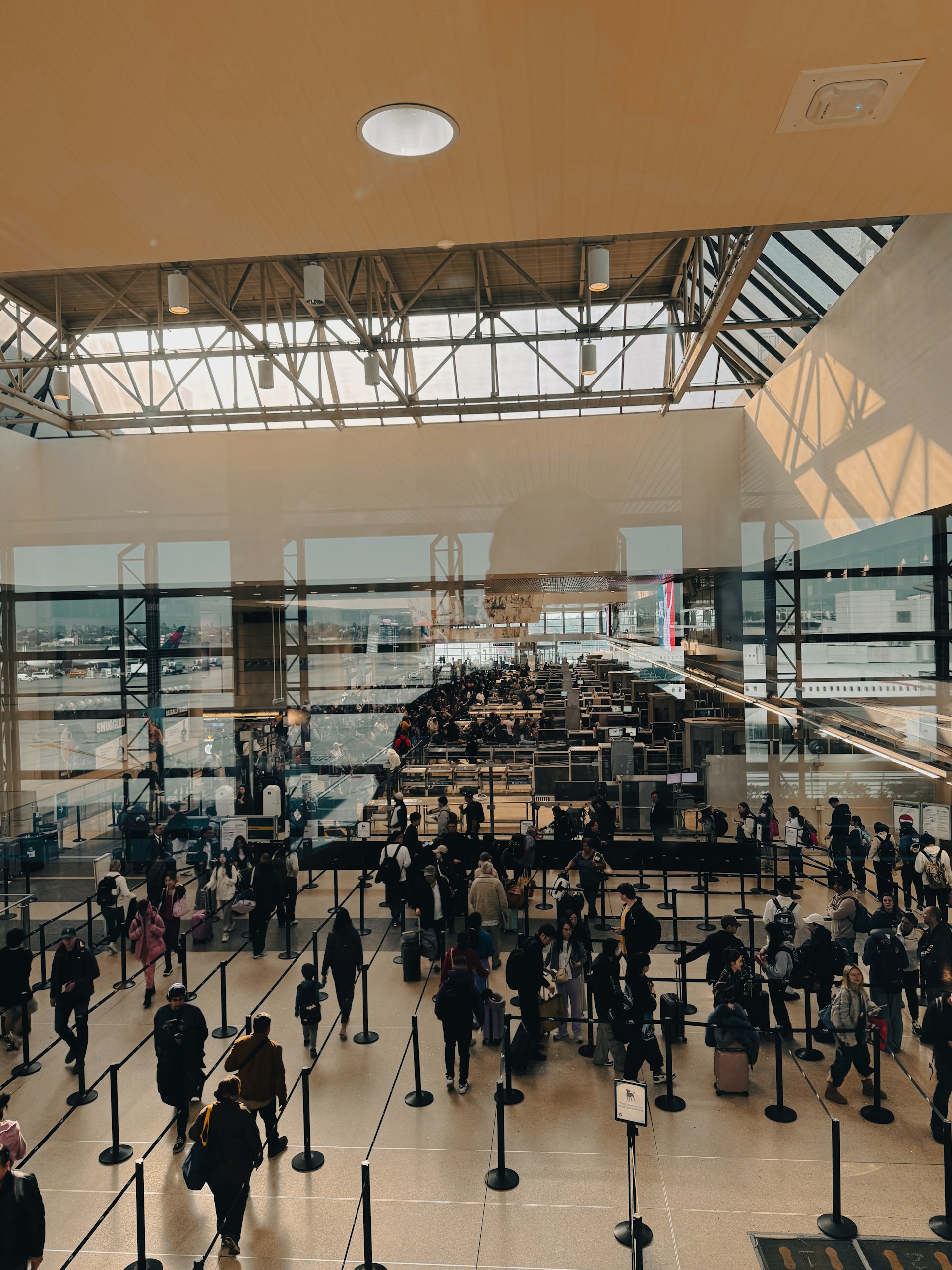 A large group of people walking around a building