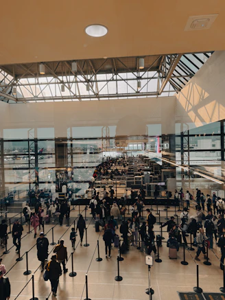 A large group of people walking around a building