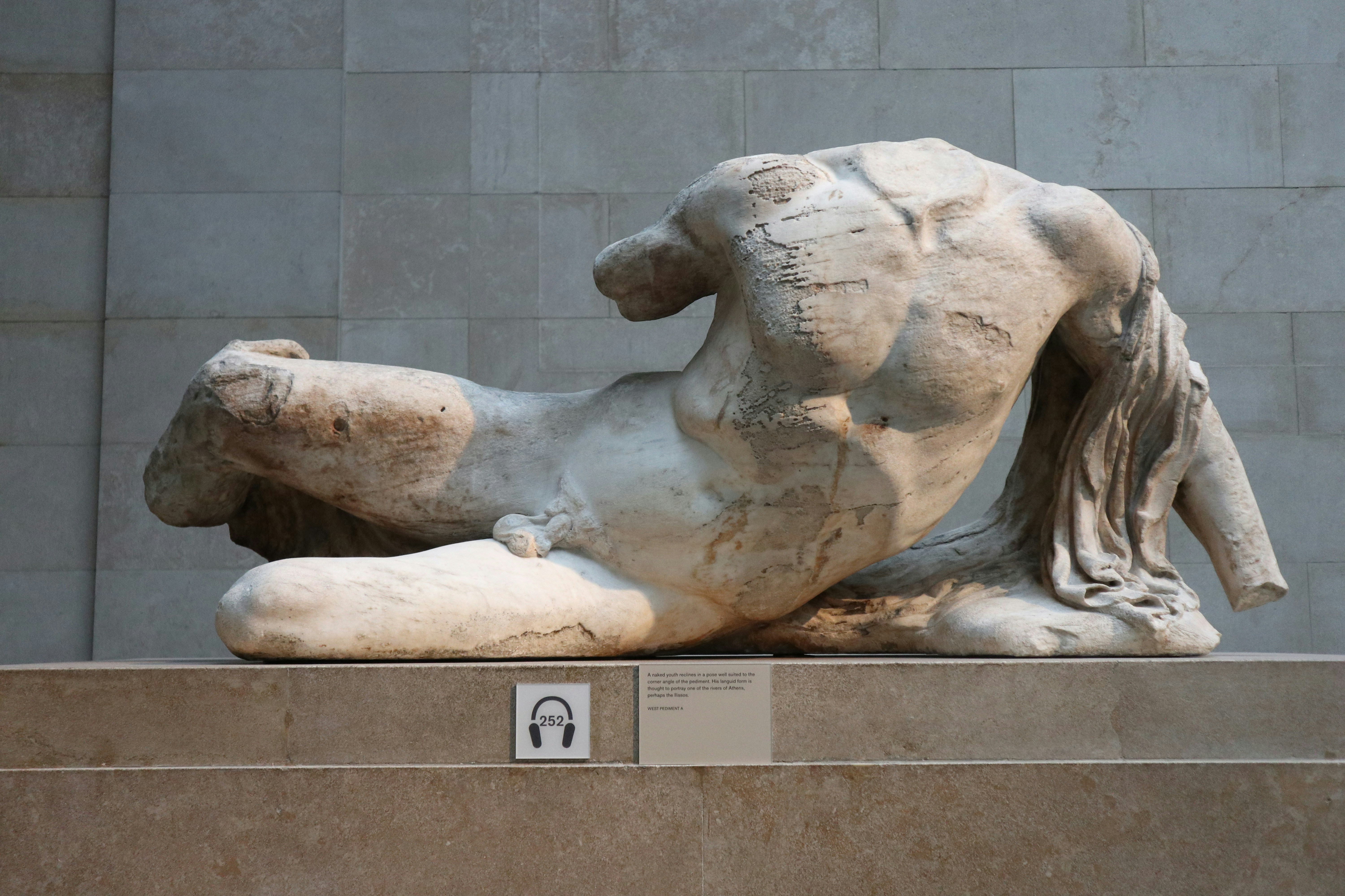 A statue of a man laying on his back
