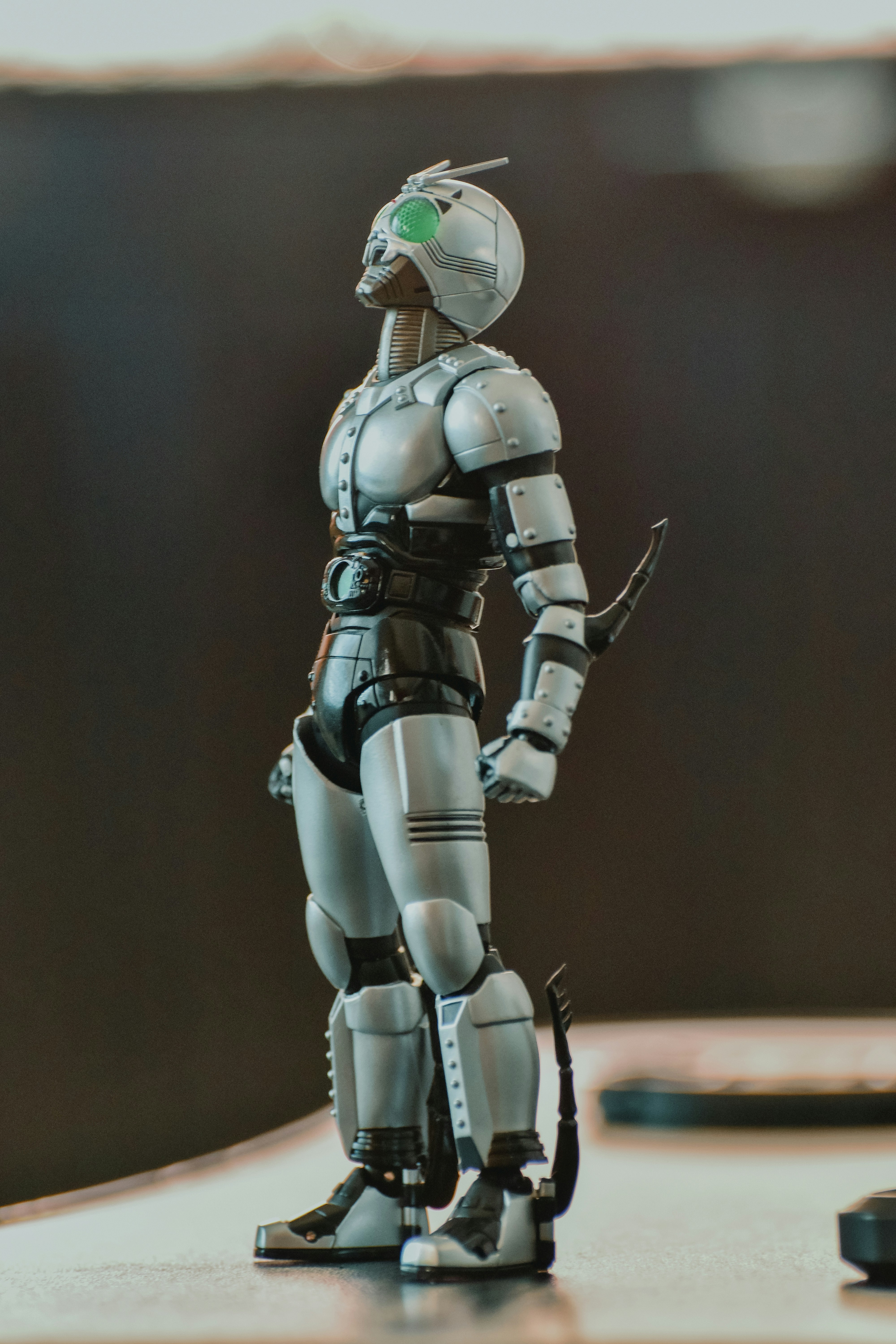 A toy robot is standing on a table