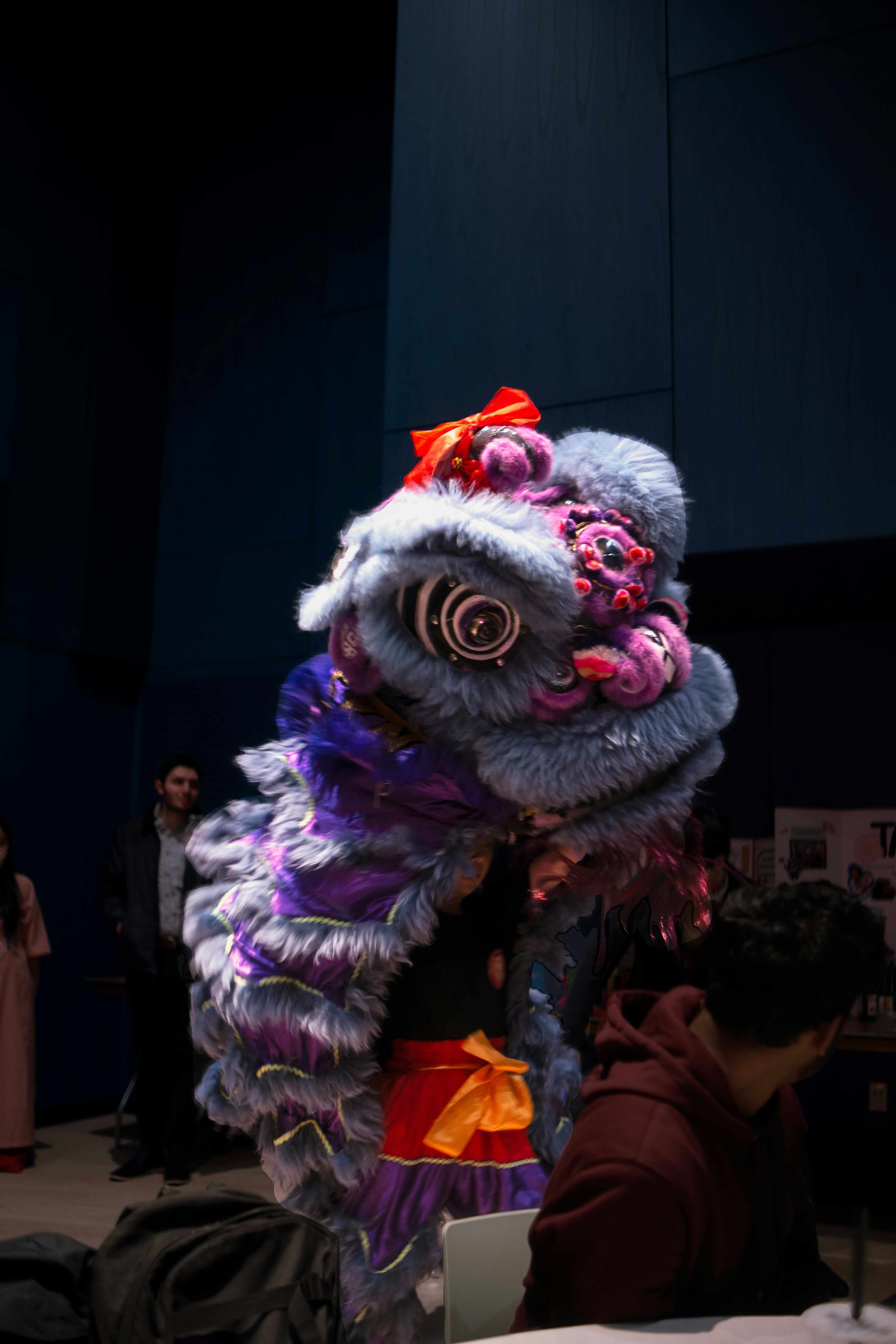 A man standing next to a table with a dragon on it