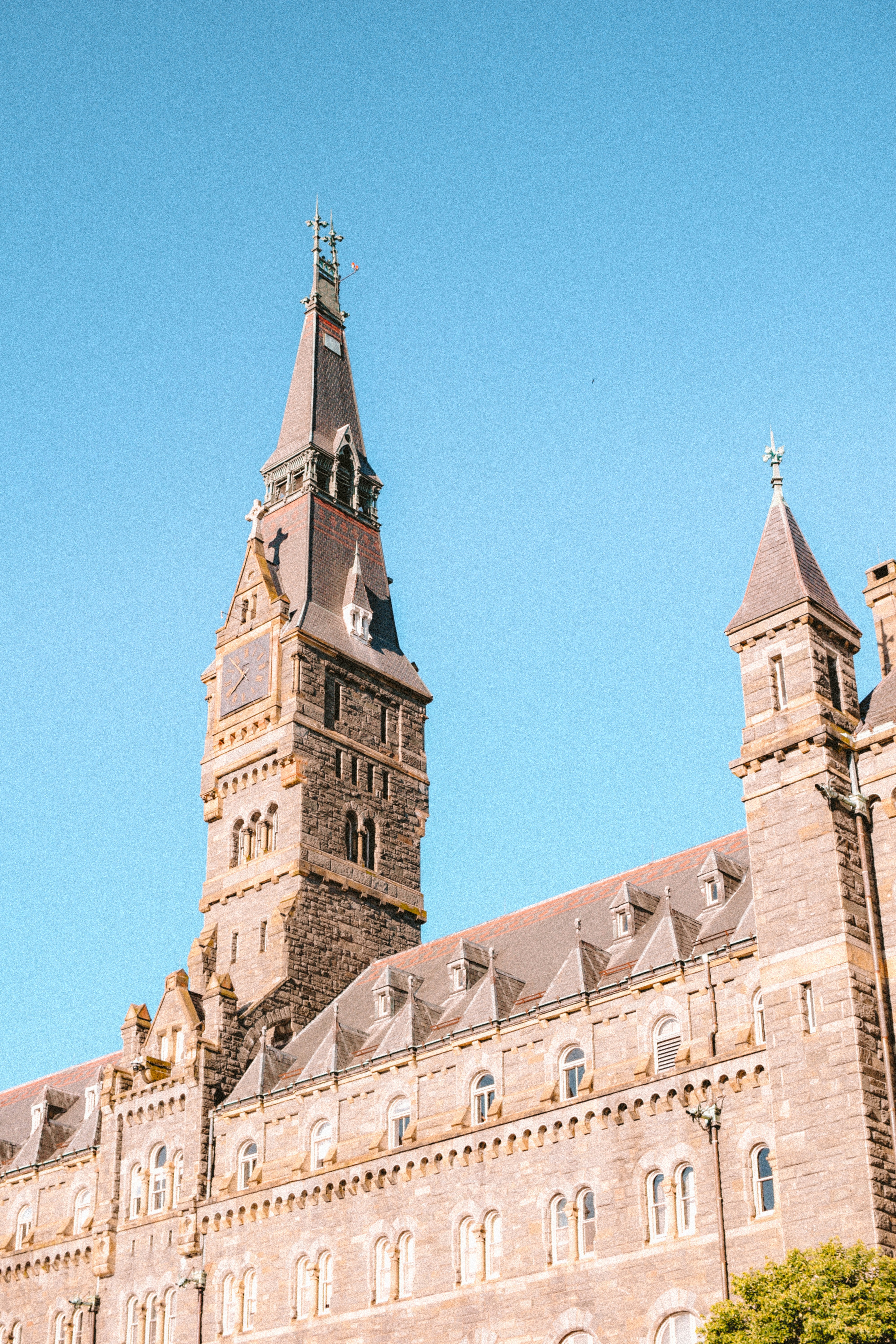 A very tall building with a clock on it's side