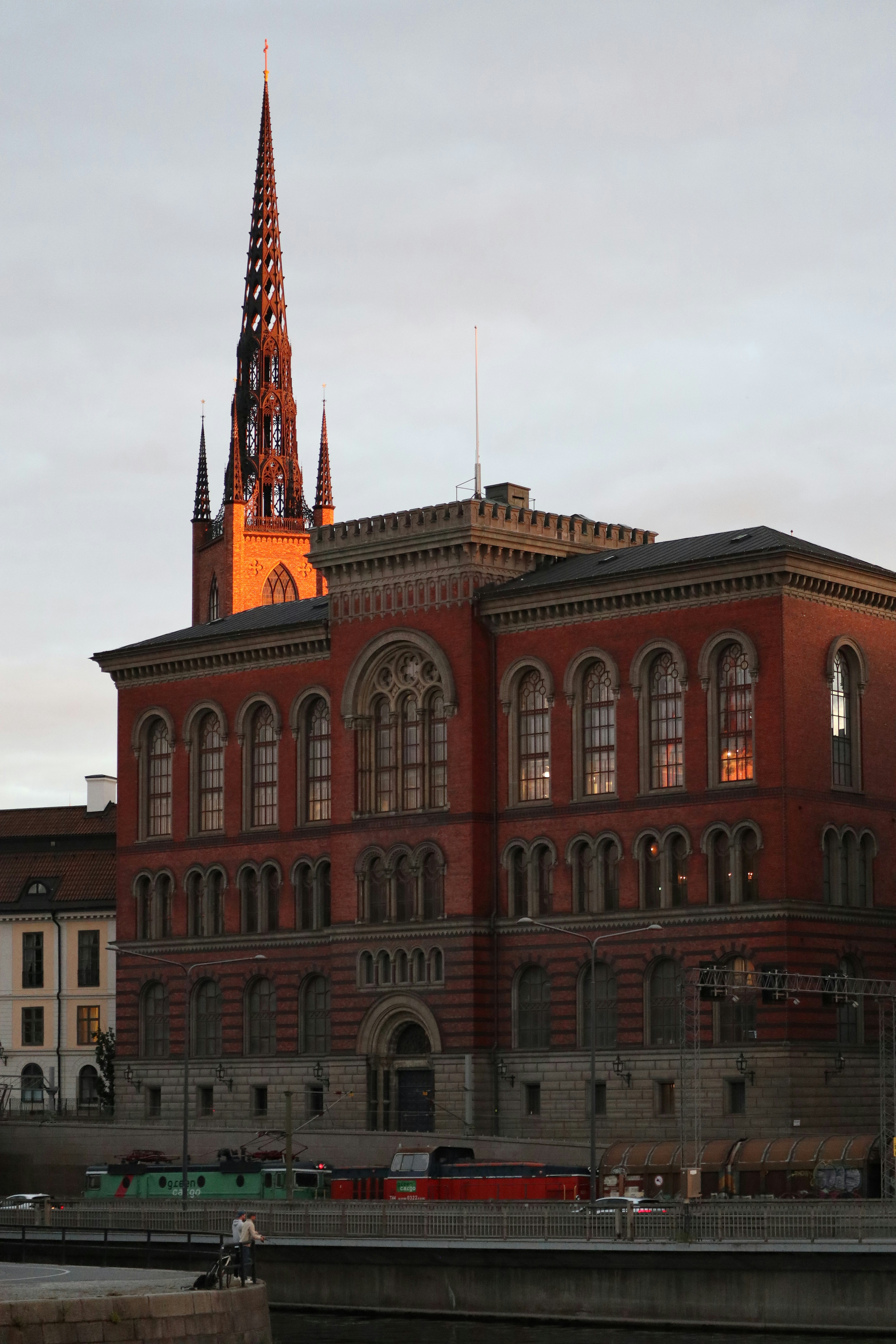 A large red brick building with a clock tower photo – Free Car Image on ...
