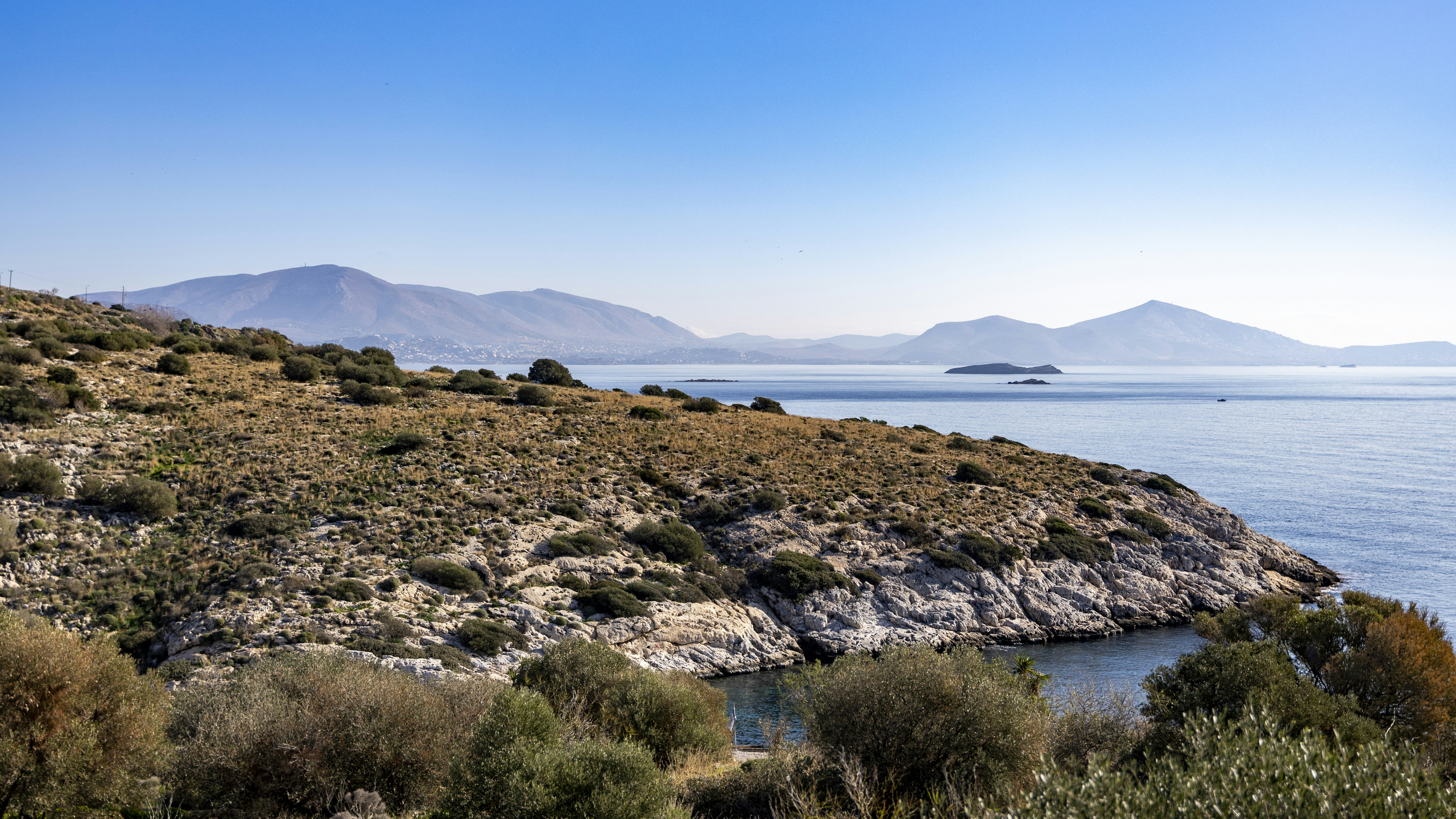 A large body of water surrounded by mountains